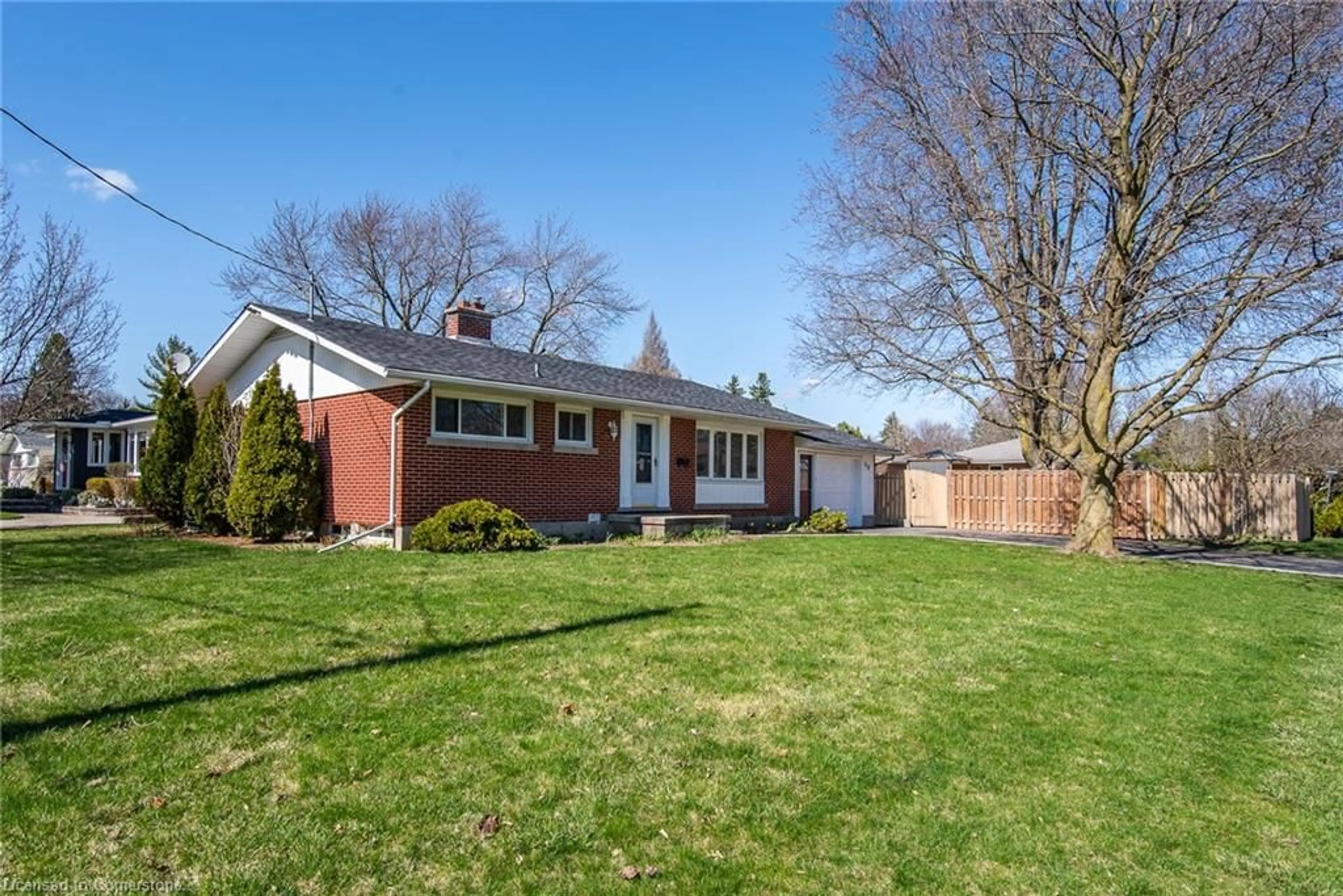 Home with brick exterior material, street for 318 Greenbrook Dr, Kitchener Ontario N2M 4K3