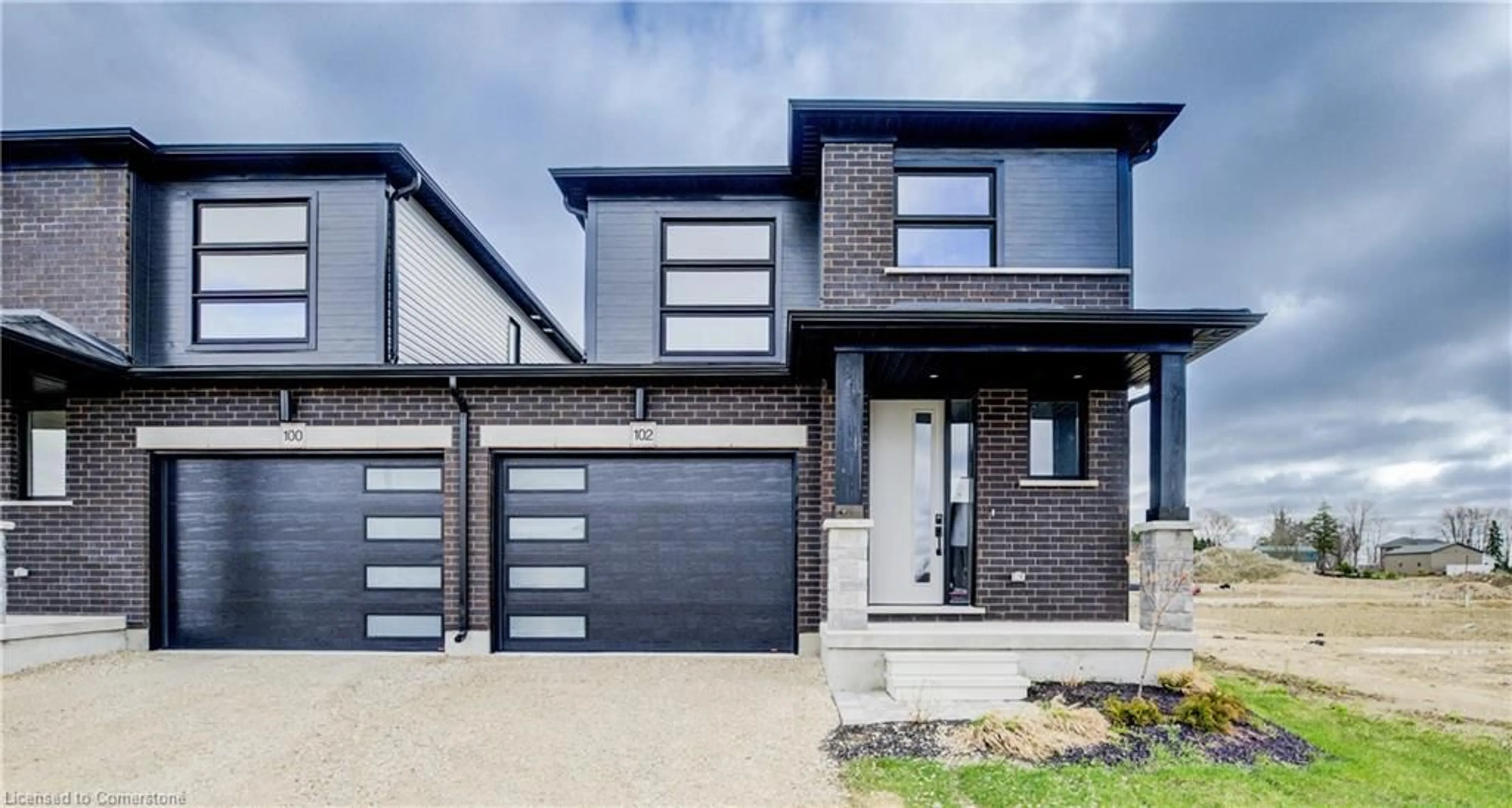 Home with brick exterior material, street for 102 Thackeray Way, Harriston Ontario N0G 1Z0