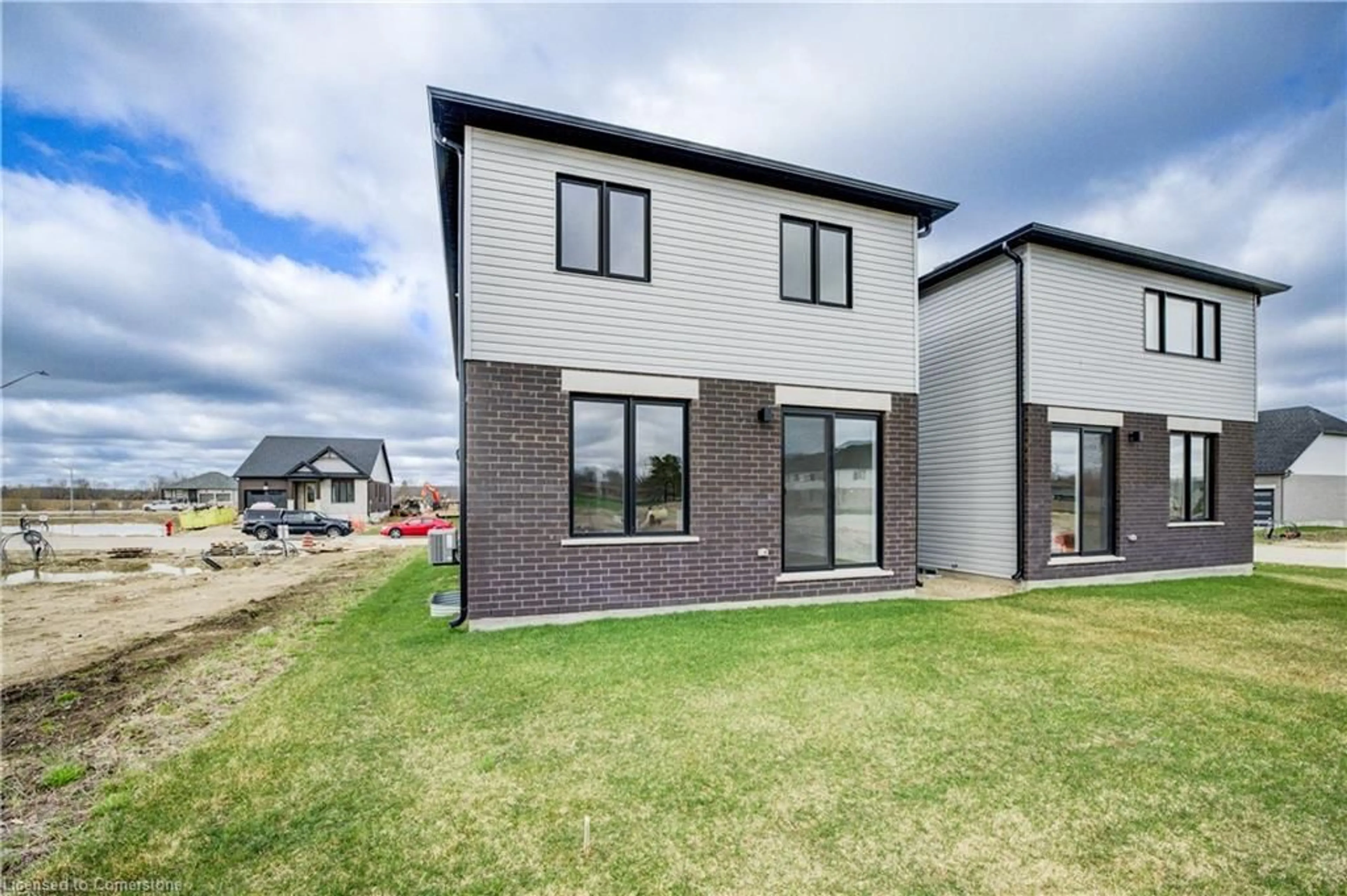 Home with brick exterior material, street for 102 Thackeray Way, Harriston Ontario N0G 1Z0