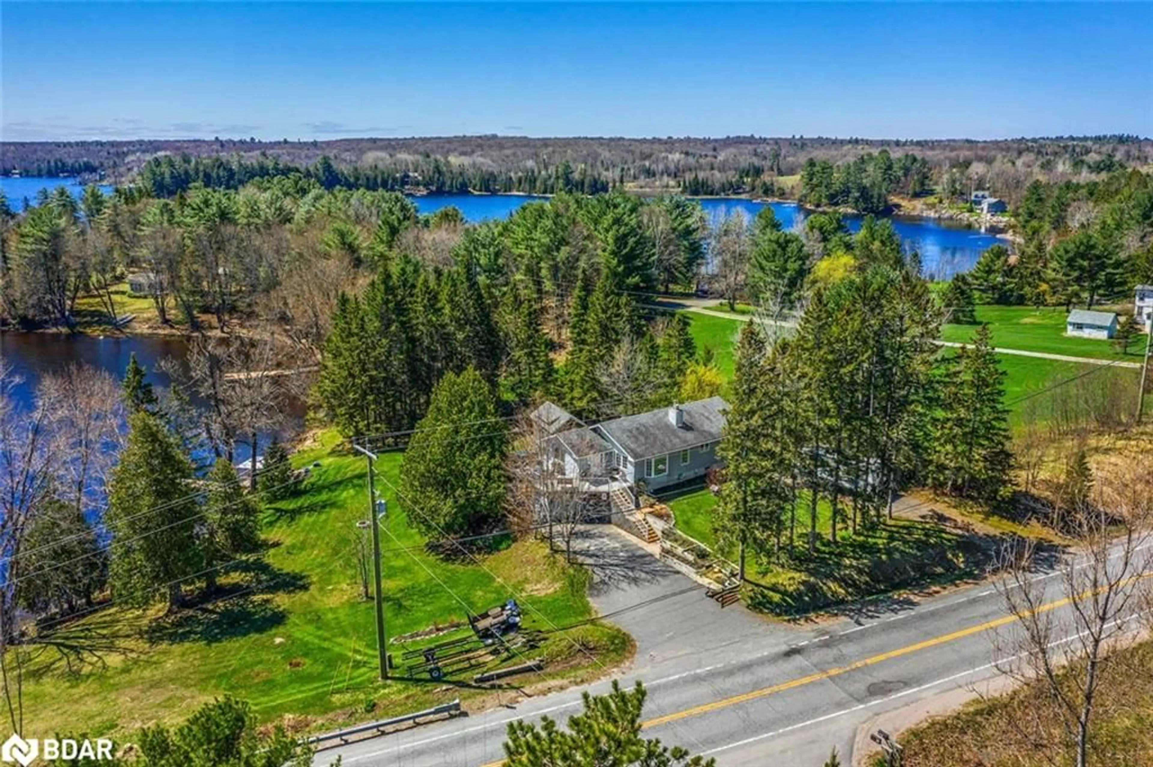 A pic from outside/outdoor area/front of a property/back of a property/a pic from drone, water/lake/river/ocean view for 1091 Hwy 518, Seguin Ontario P2A 2W9