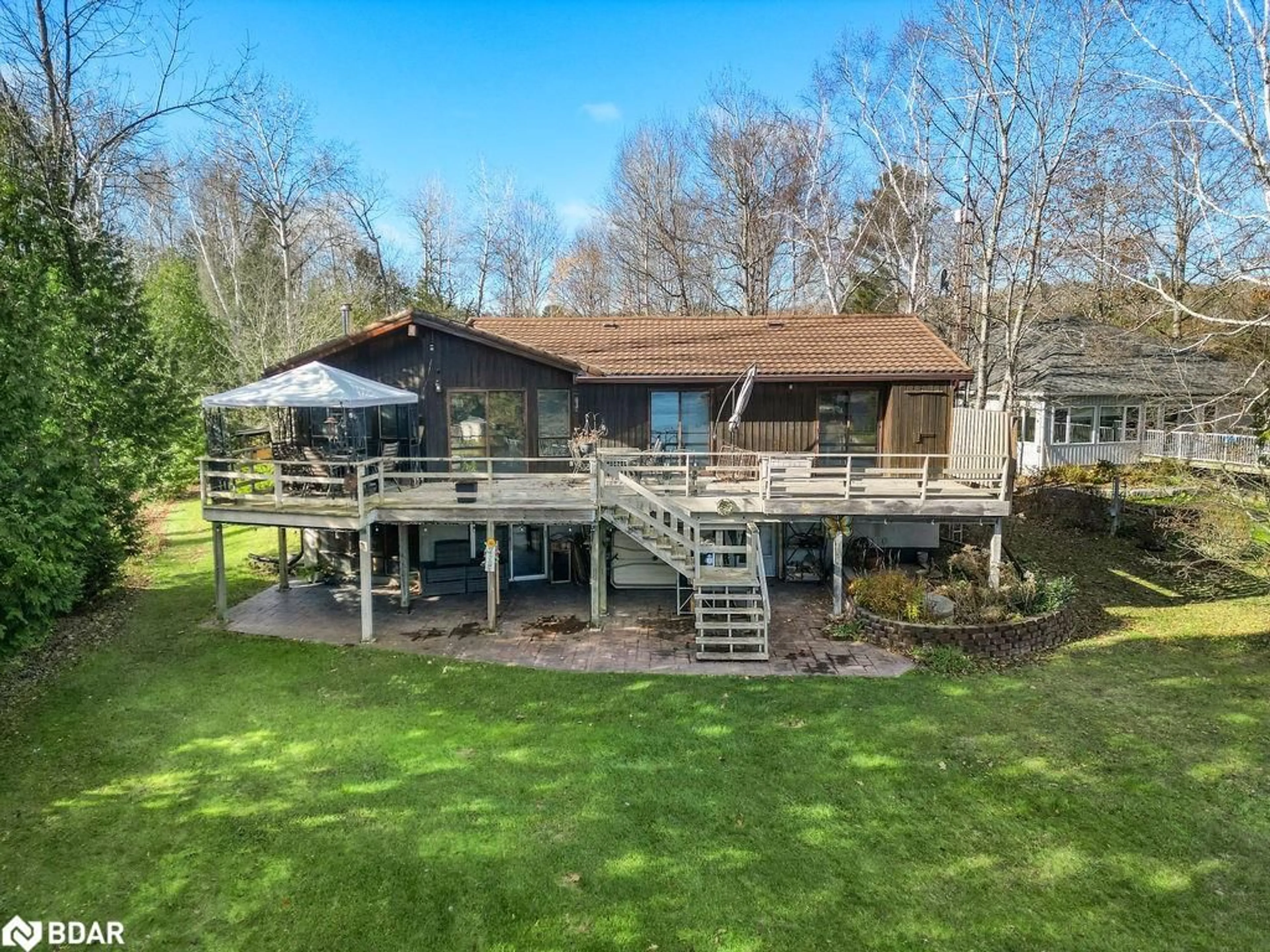 A pic from outside/outdoor area/front of a property/back of a property/a pic from drone, water/lake/river/ocean view for 217 Adam And Eve Rd, Buckhorn Ontario K0L 1J0