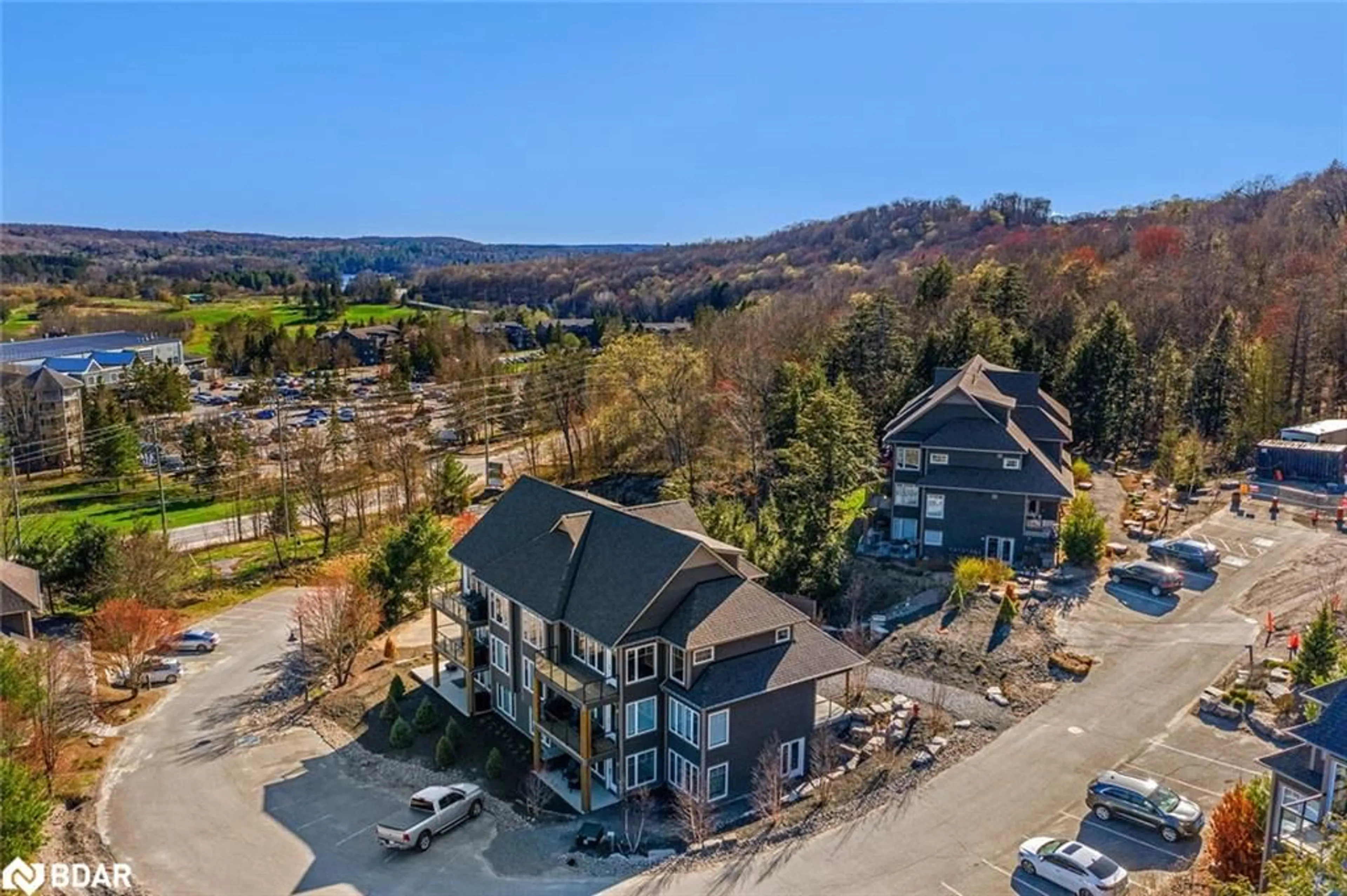 A pic from outside/outdoor area/front of a property/back of a property/a pic from drone, mountain view for 2 Tree Tops Lane, Huntsville Ontario P1H 0B8
