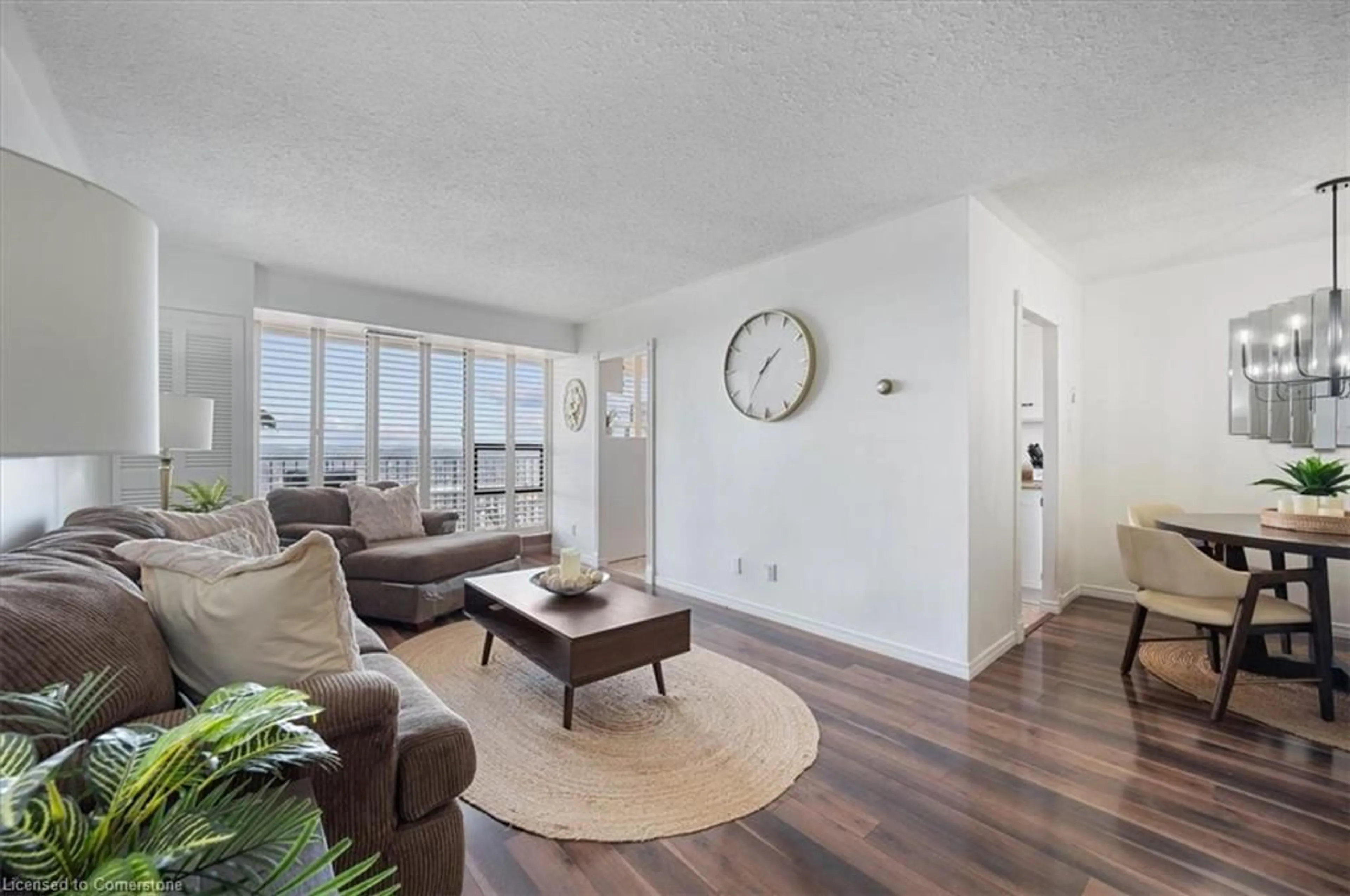 Living room with furniture, wood/laminate floor for 81 Church St #1307, Kitchener Ontario N2G 4M1