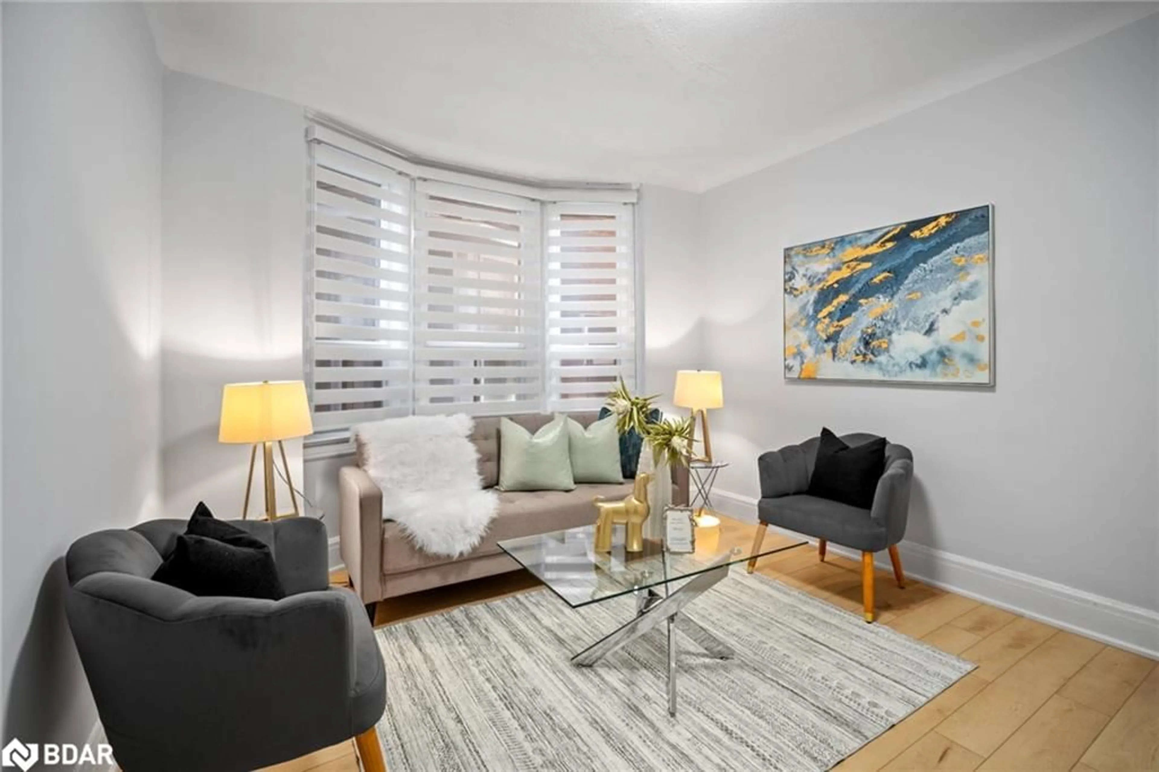 Living room with furniture, wood/laminate floor for 80 Mavety St, Toronto Ontario M6P 2L8