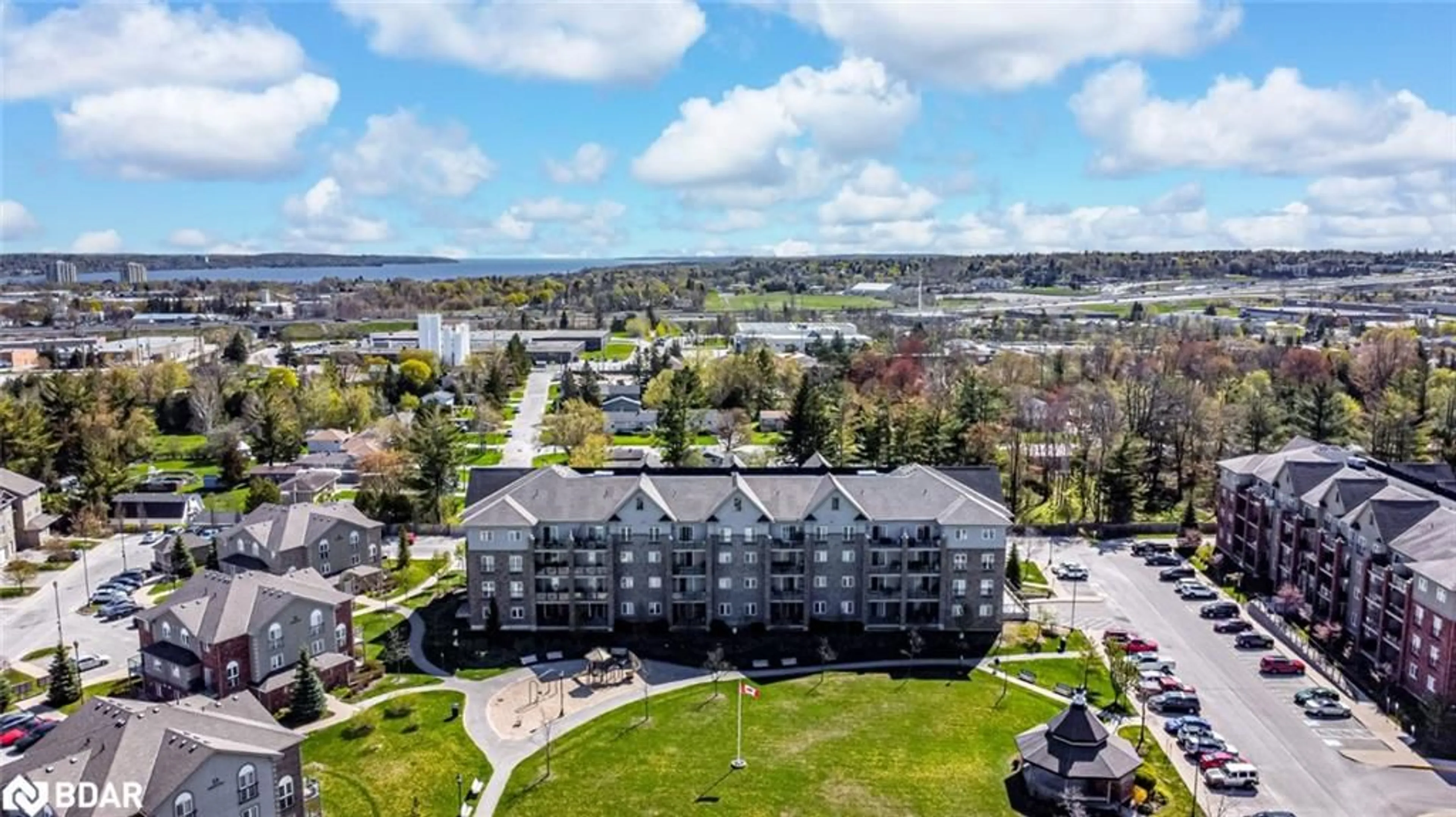 A pic from outside/outdoor area/front of a property/back of a property/a pic from drone, water/lake/river/ocean view for 45 Ferndale Dr #305, Barrie Ontario L4N 5W7