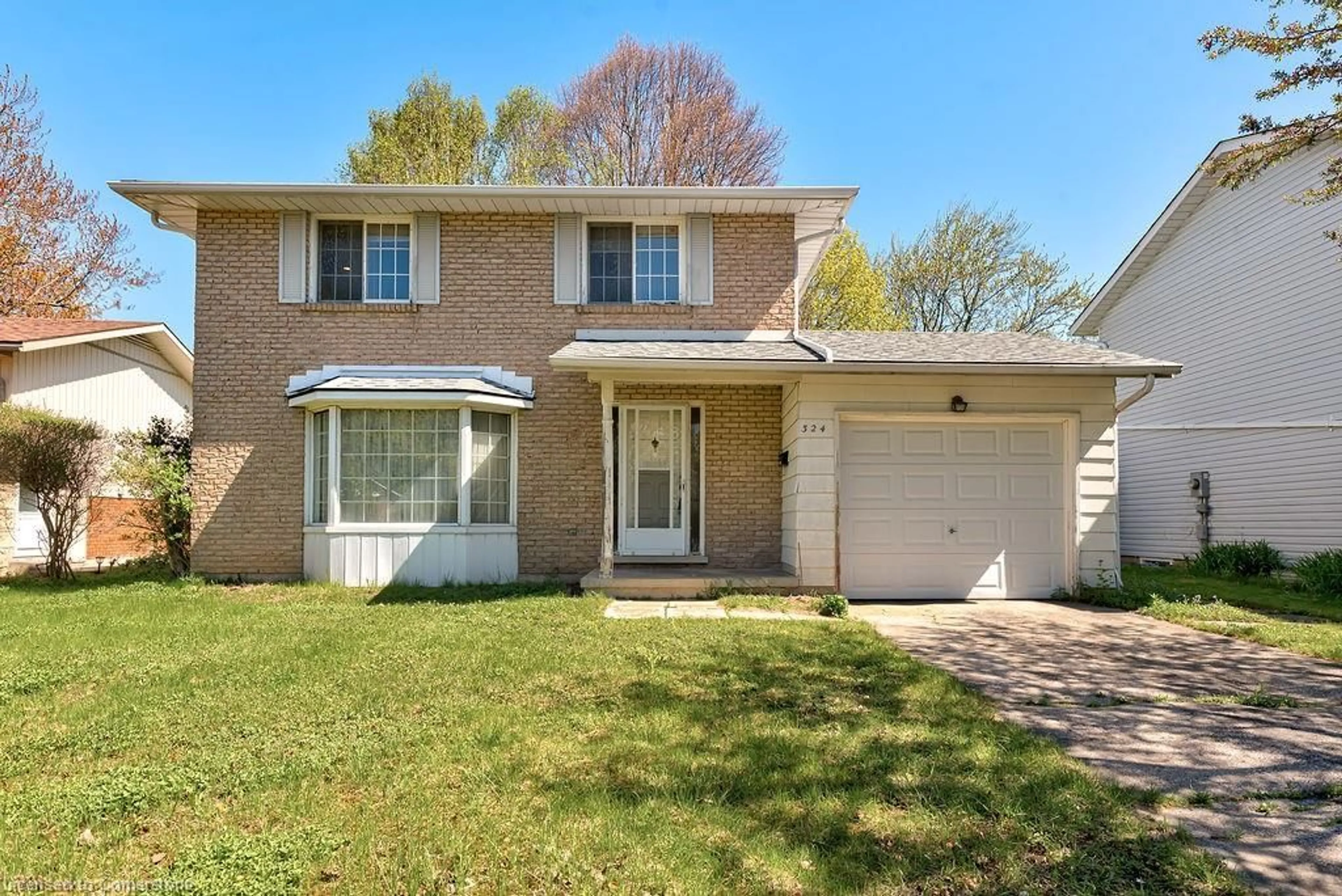 Home with brick exterior material, street for 324 Sandowne Dr, Waterloo Ontario N2K 1V8