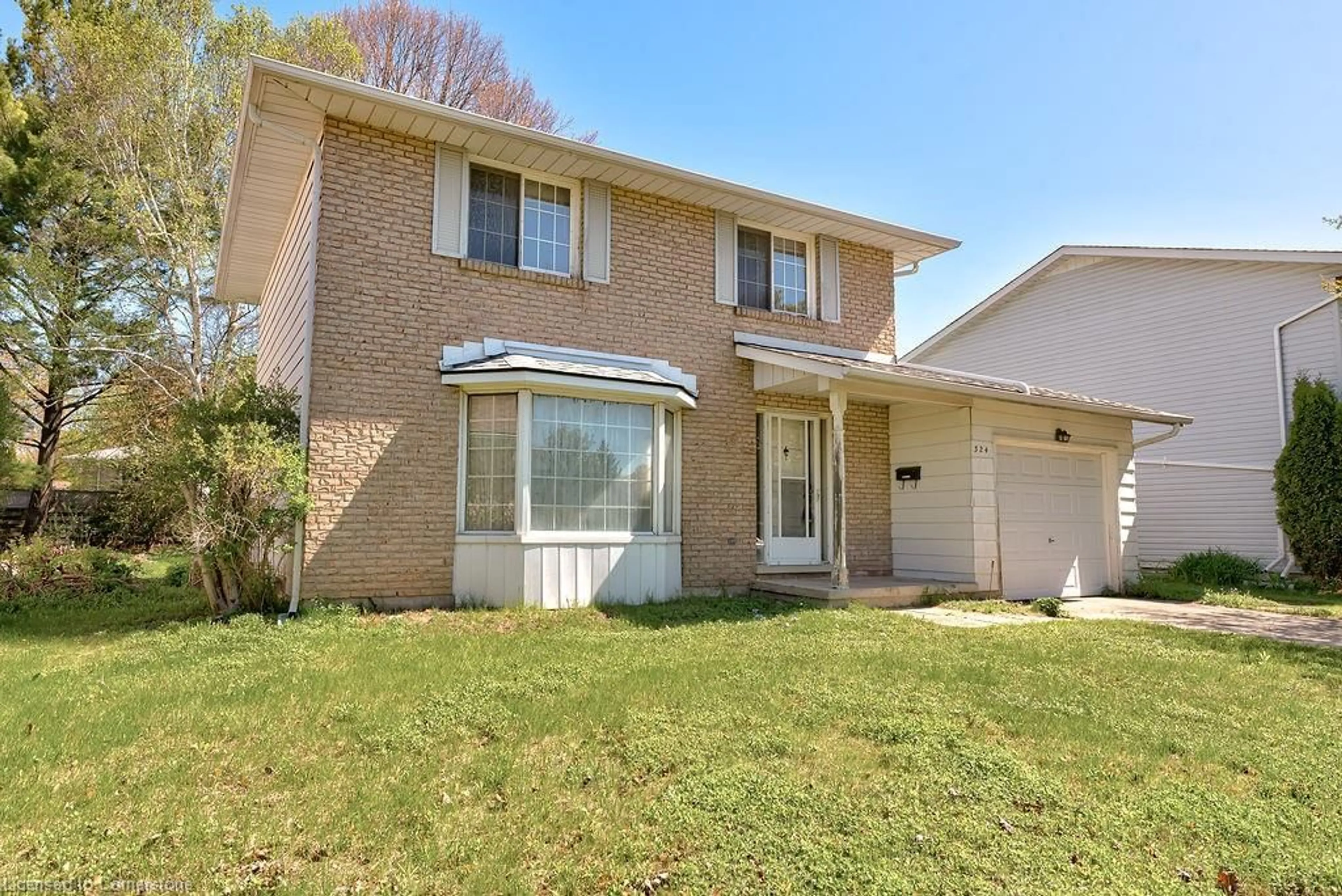 Home with brick exterior material, street for 324 Sandowne Dr, Waterloo Ontario N2K 1V8