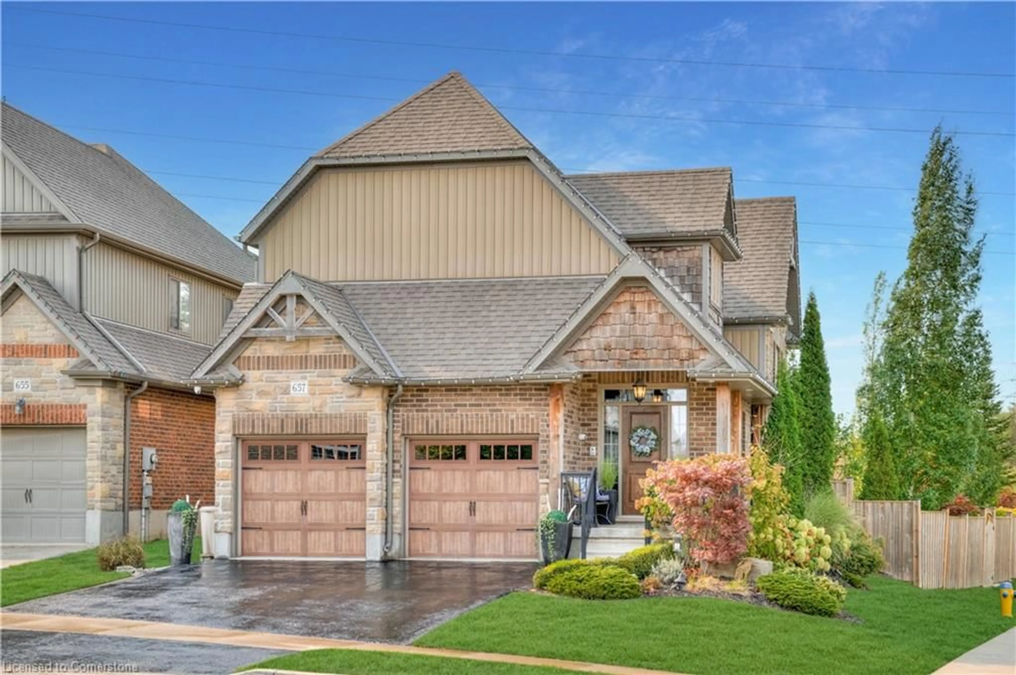 Home with brick exterior material, street for 657 Montpellier Dr, Waterloo Ontario N2T 0B3