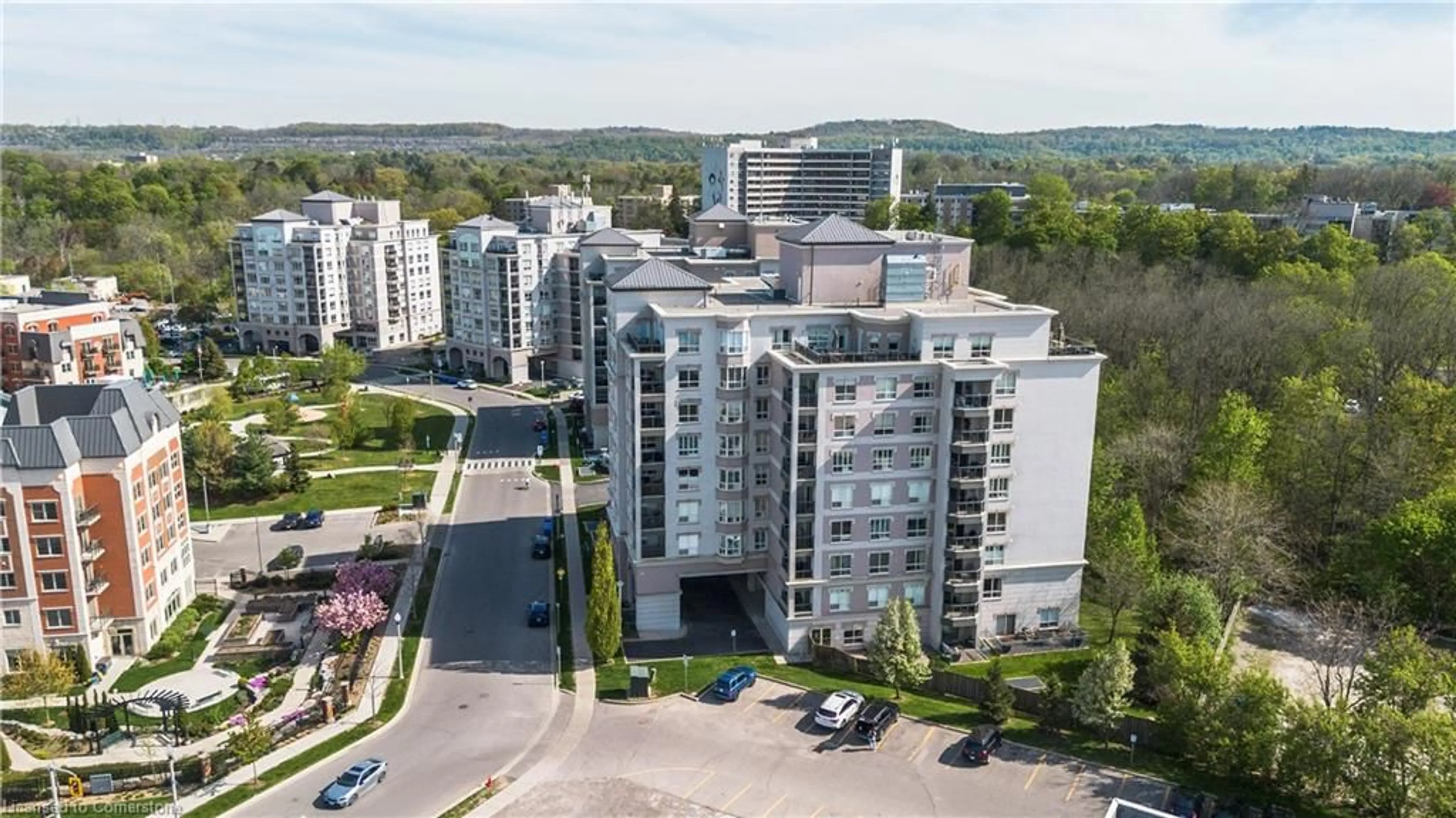 A pic from outside/outdoor area/front of a property/back of a property/a pic from drone, unknown for 4000 Creekside Dr #207, Dundas Ontario L9H 7S9