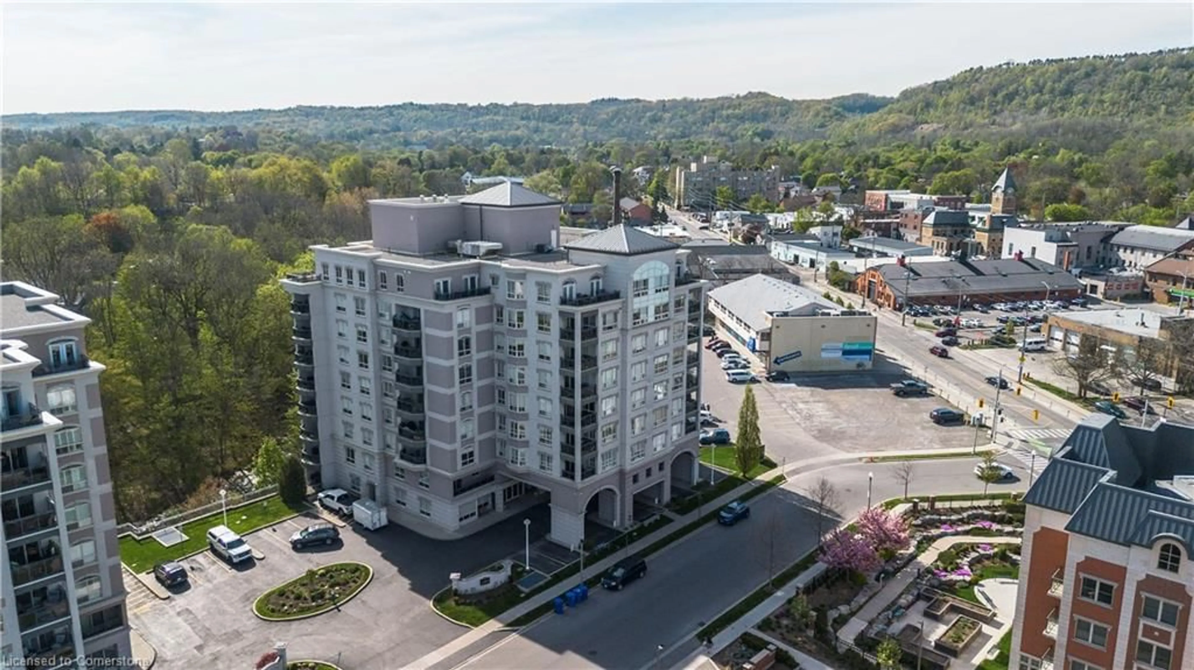 A pic from outside/outdoor area/front of a property/back of a property/a pic from drone, unknown for 4000 Creekside Dr #207, Dundas Ontario L9H 7S9