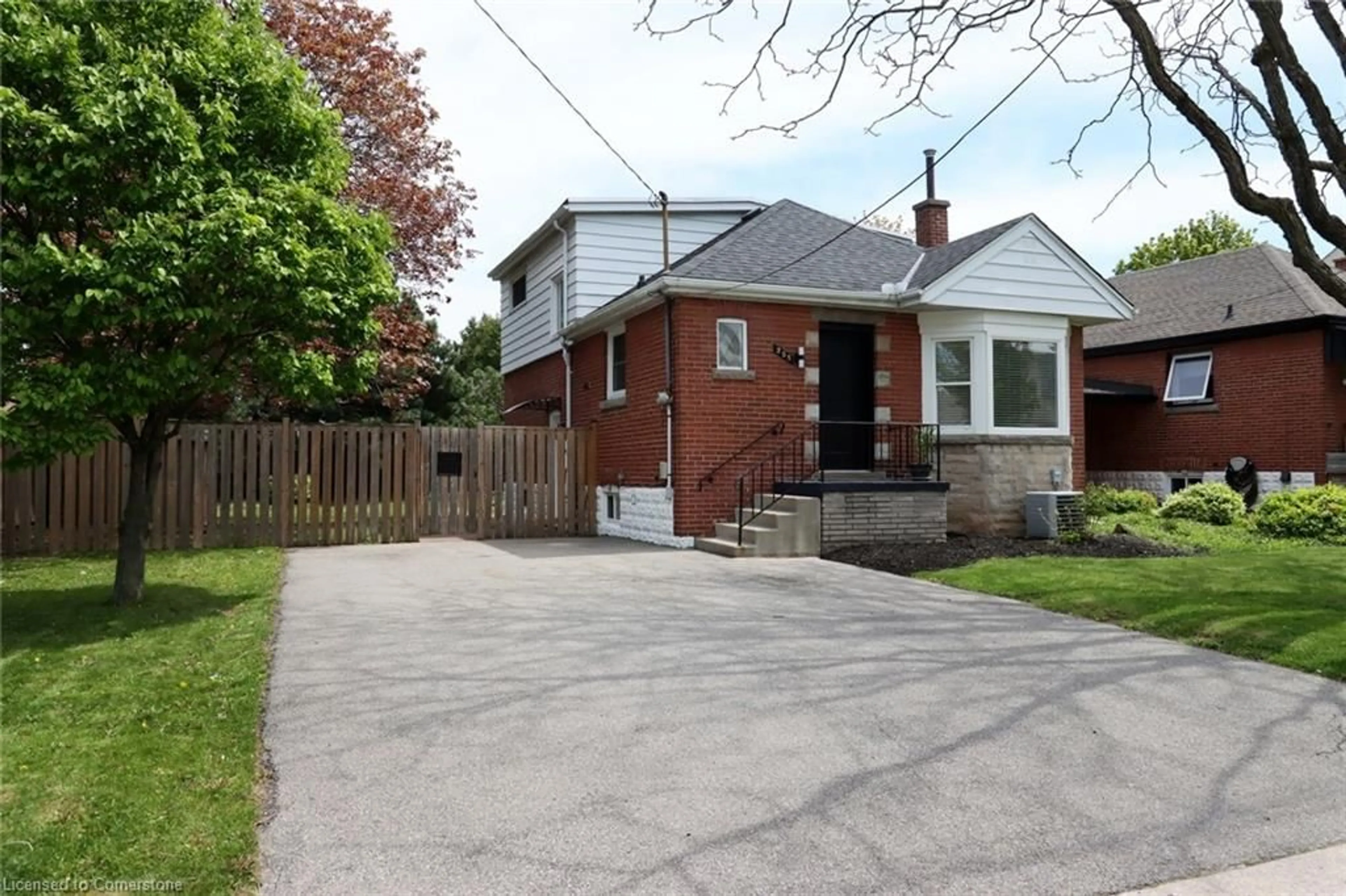 Home with brick exterior material, street for 255 East 11th St, Hamilton Ontario L9A 3T8