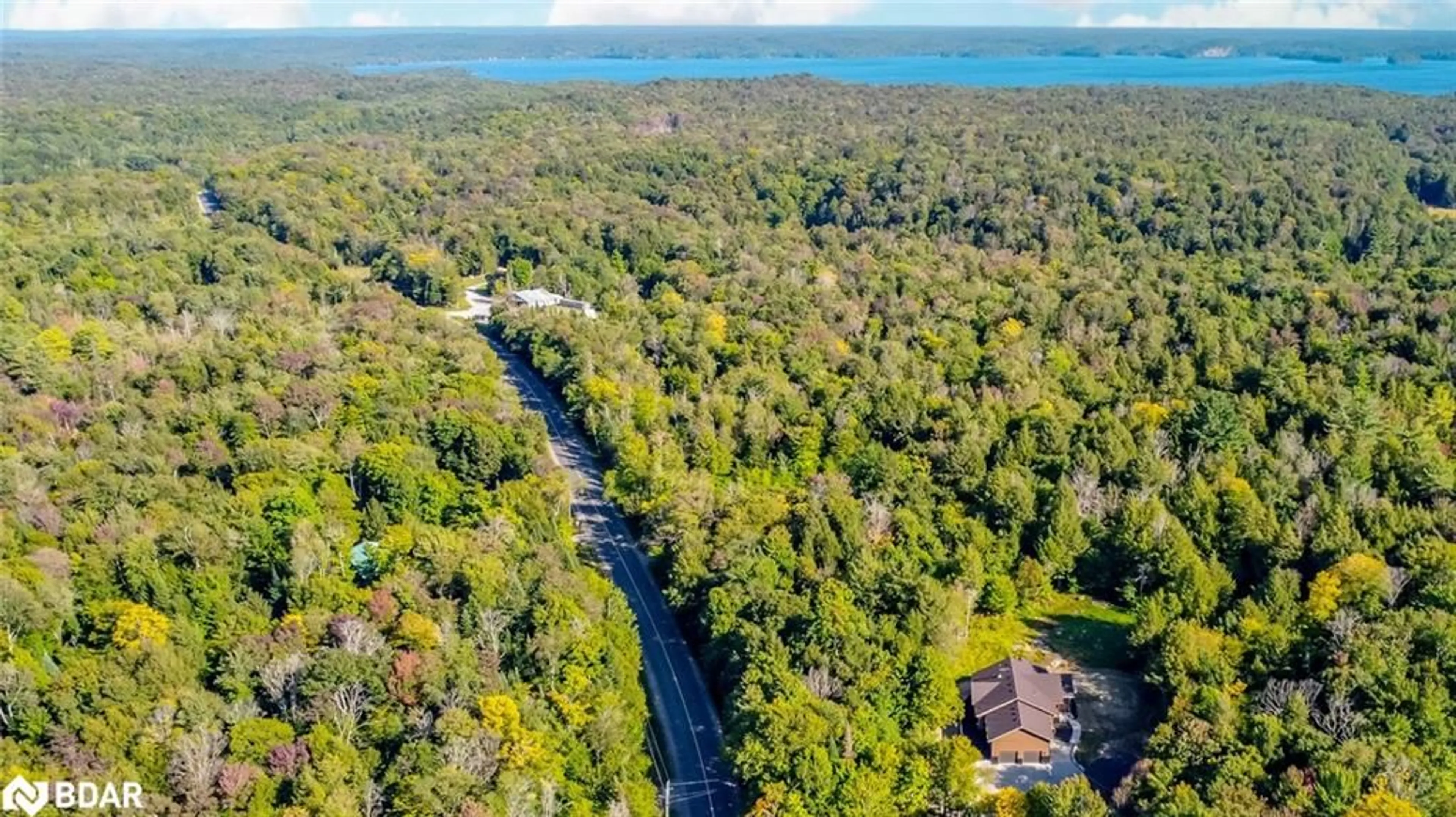A pic from outside/outdoor area/front of a property/back of a property/a pic from drone, water/lake/river/ocean view for 4571 Aspdin Rd, Utterson Ontario P0B 1M0