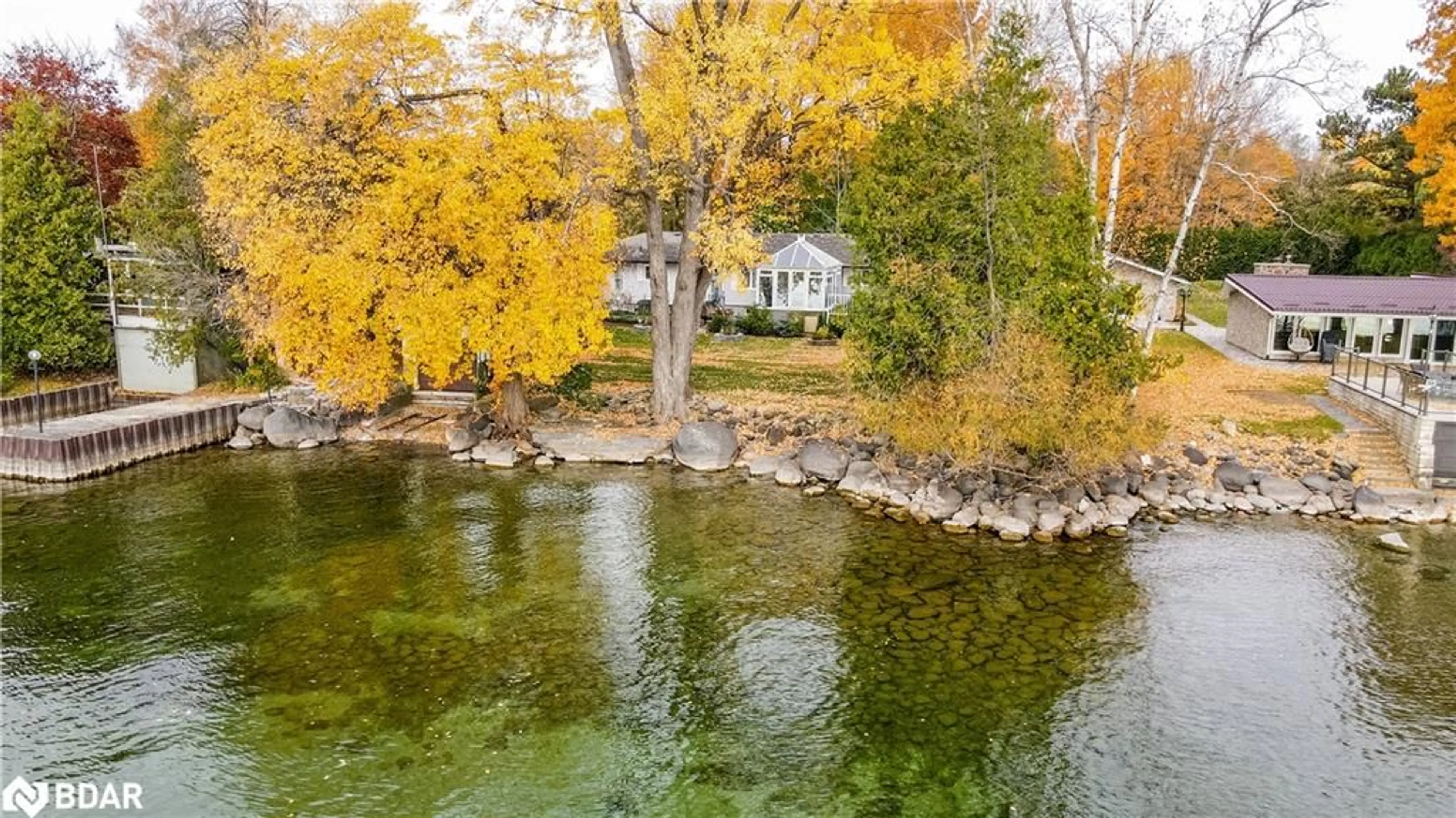 A pic from outside/outdoor area/front of a property/back of a property/a pic from drone, water/lake/river/ocean view for 155 Parkside Dr Dr, Oro-Medonte Ontario L3V 0K8