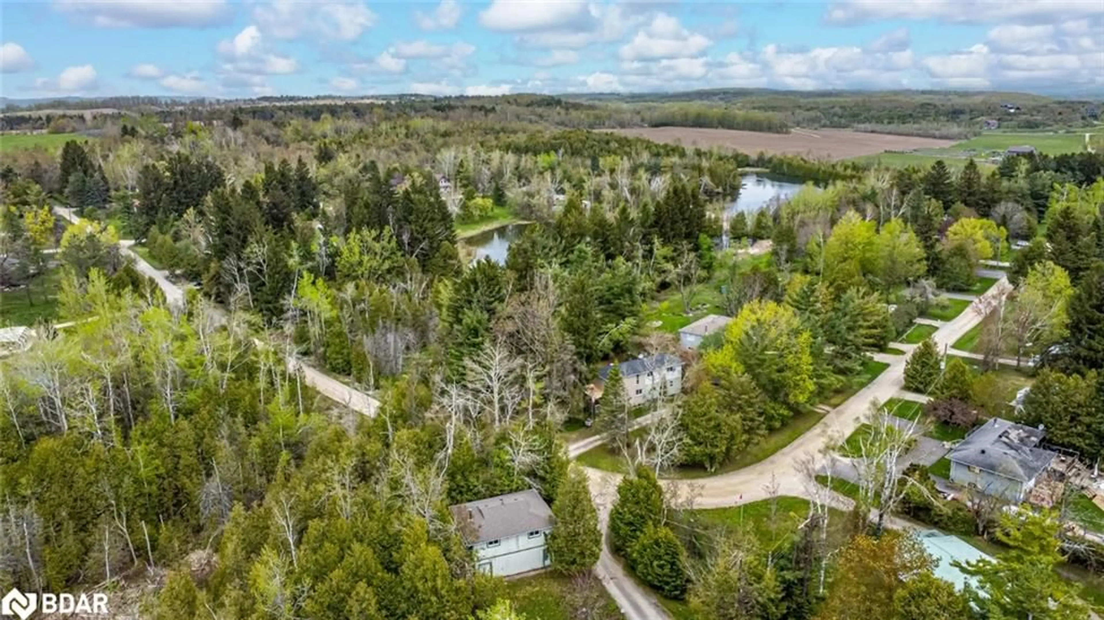 A pic from outside/outdoor area/front of a property/back of a property/a pic from drone, forest/trees view for 6 Mccutcheon Road, Mulmur Ontario L9V 3E8