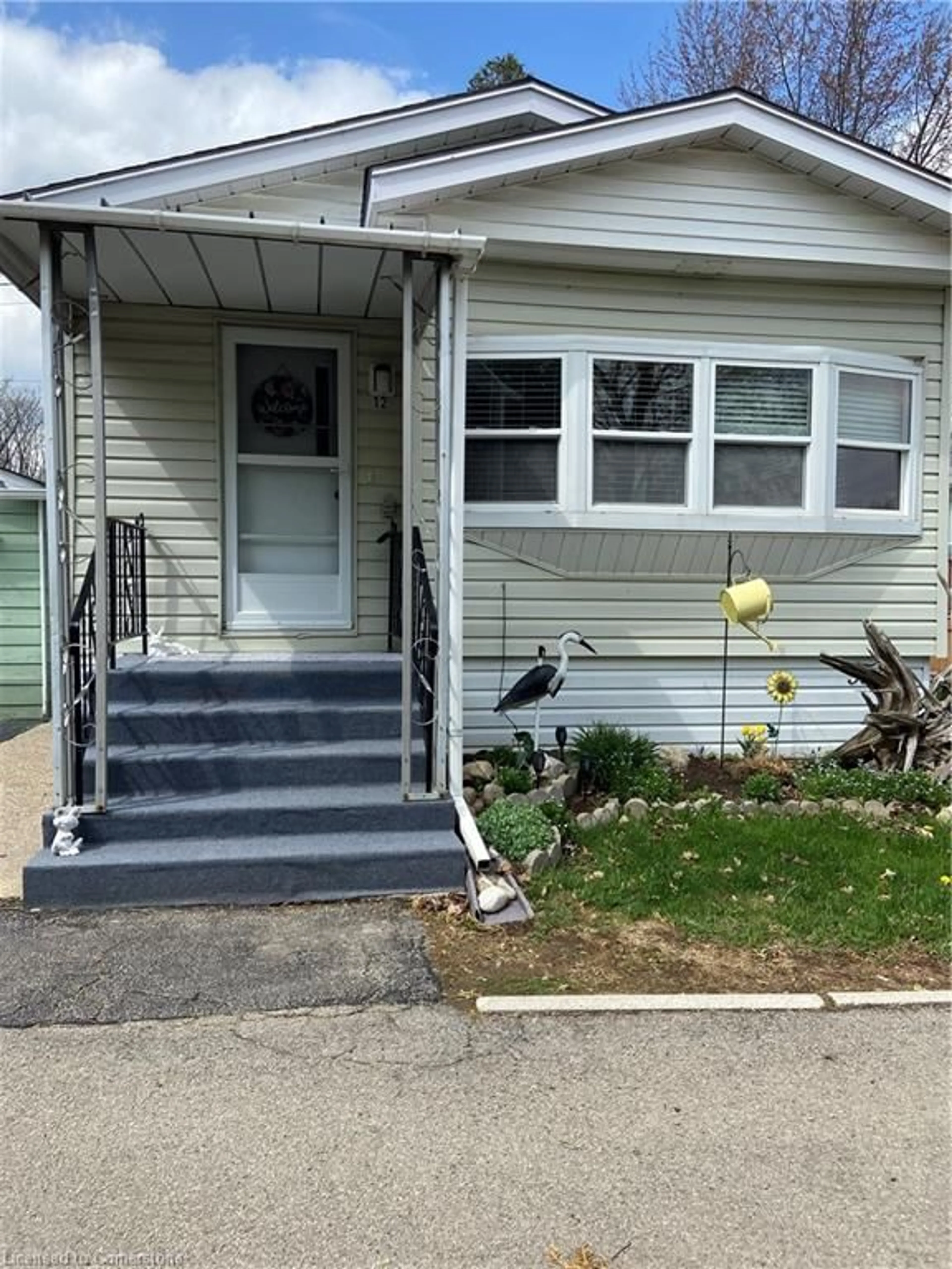 Home with vinyl exterior material, street for 12 Macpherson Cres, Flamborough Ontario N0B 2J0