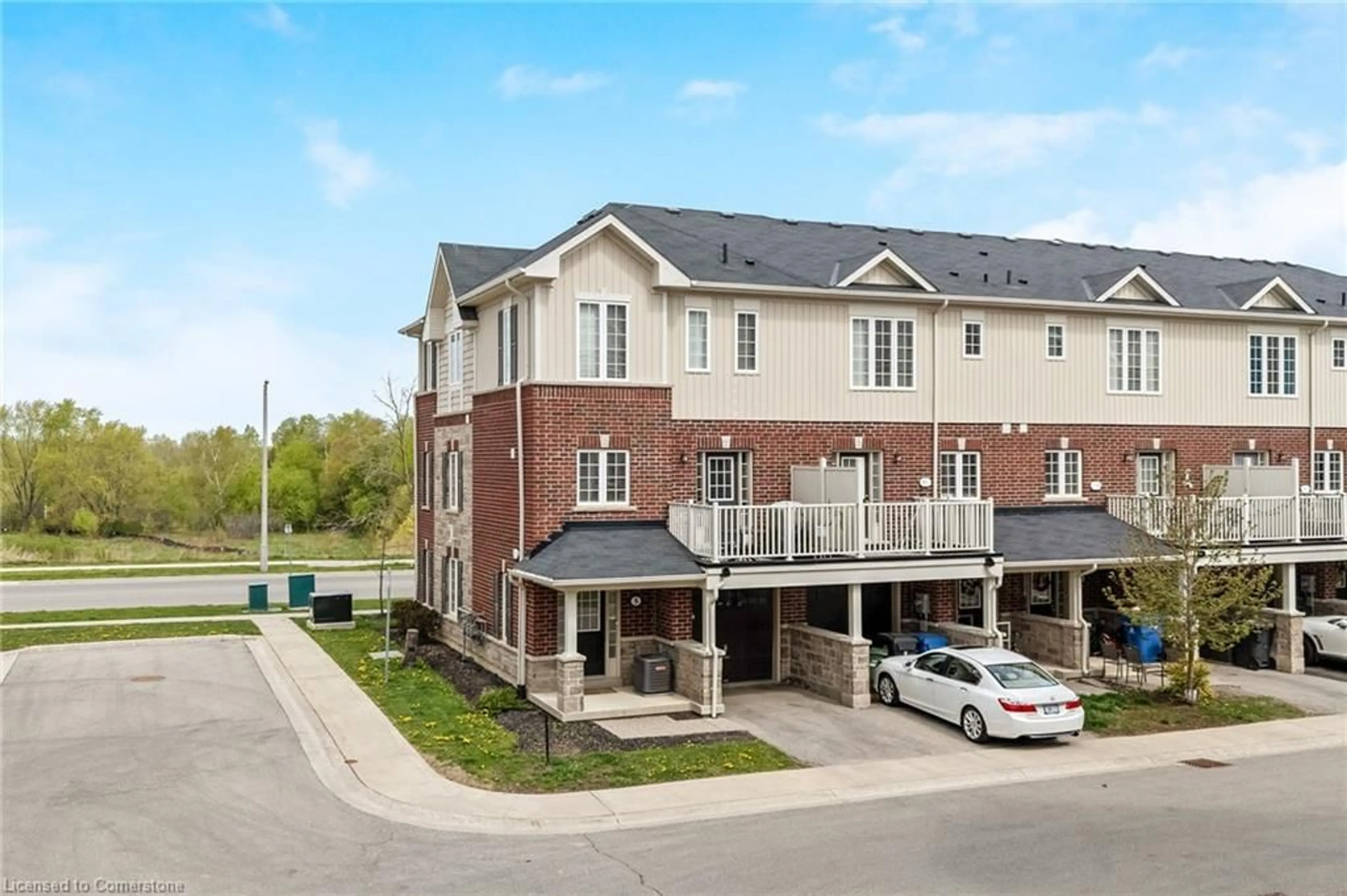 A pic from outside/outdoor area/front of a property/back of a property/a pic from drone, street for 88 Decorso Drive Dr #5, Guelph Ontario N1L 0A1