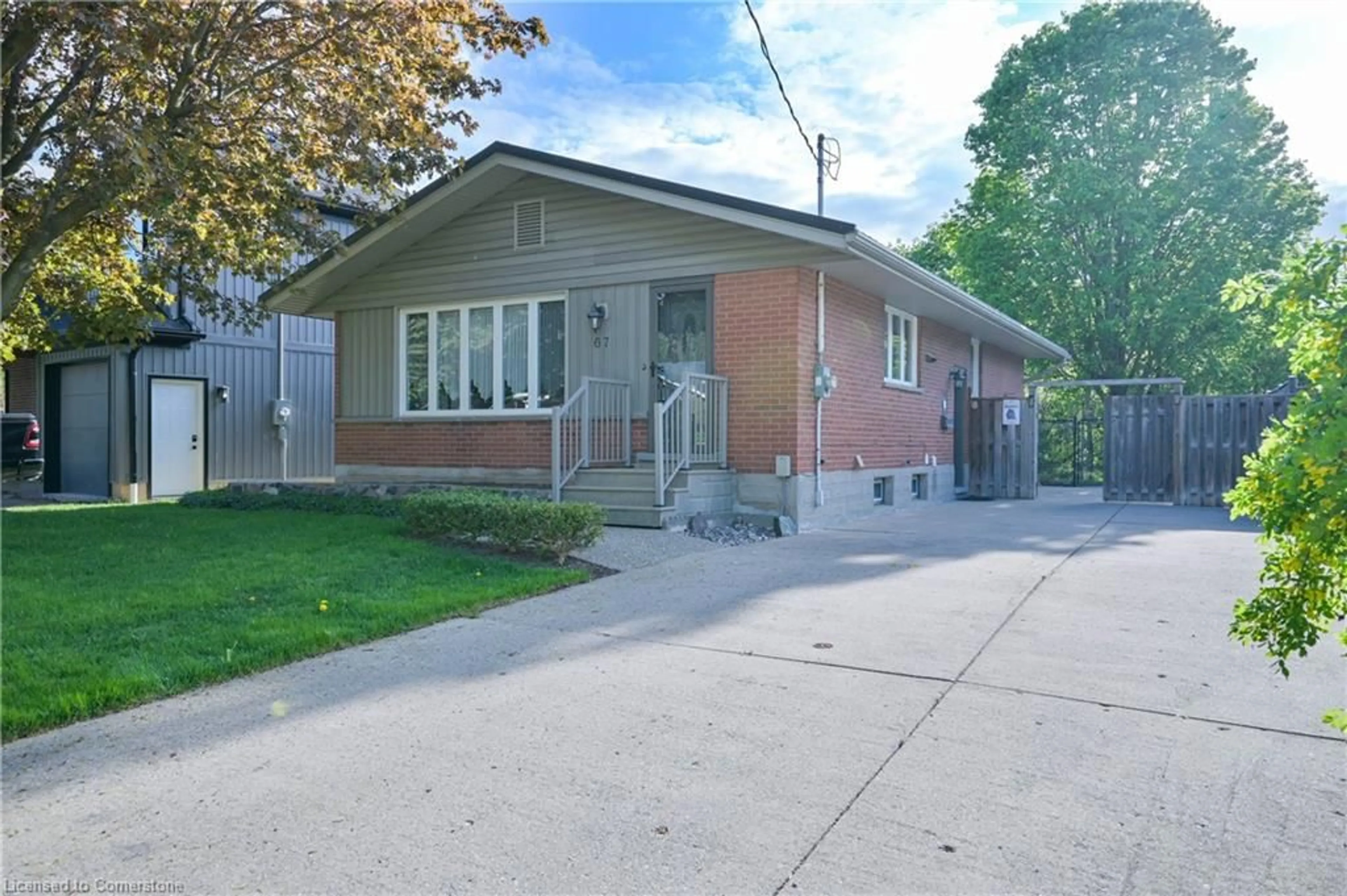 Home with brick exterior material, street for 67 Ruskview Rd, Kitchener Ontario N2M 4S1