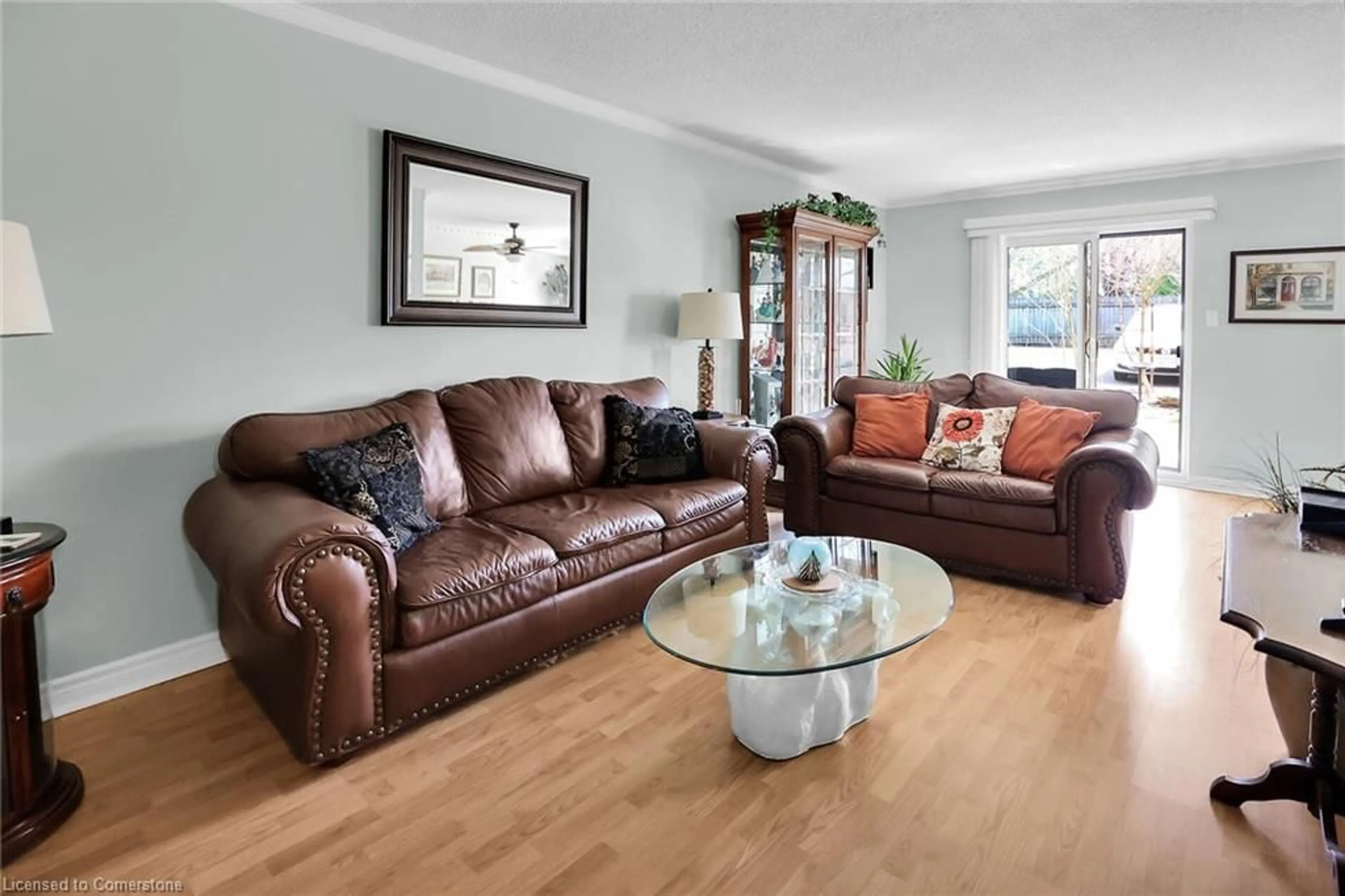 Living room with furniture, wood/laminate floor for 4209 Hixon St #108, Beamsville Ontario L3J 0K2