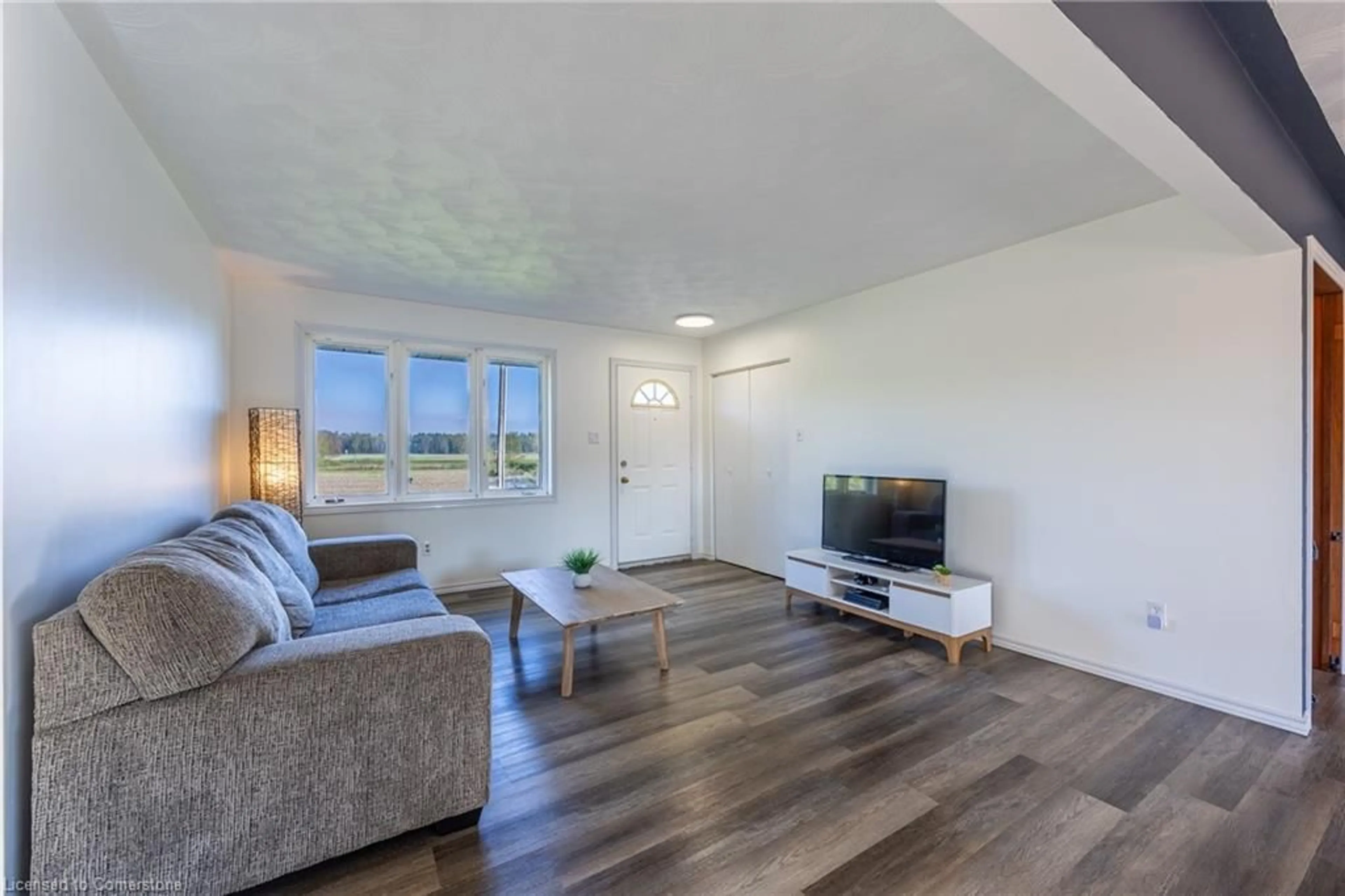 Living room with furniture, wood/laminate floor for 12 3rd Concession Rd, South Middleton Ontario N0J 1E0