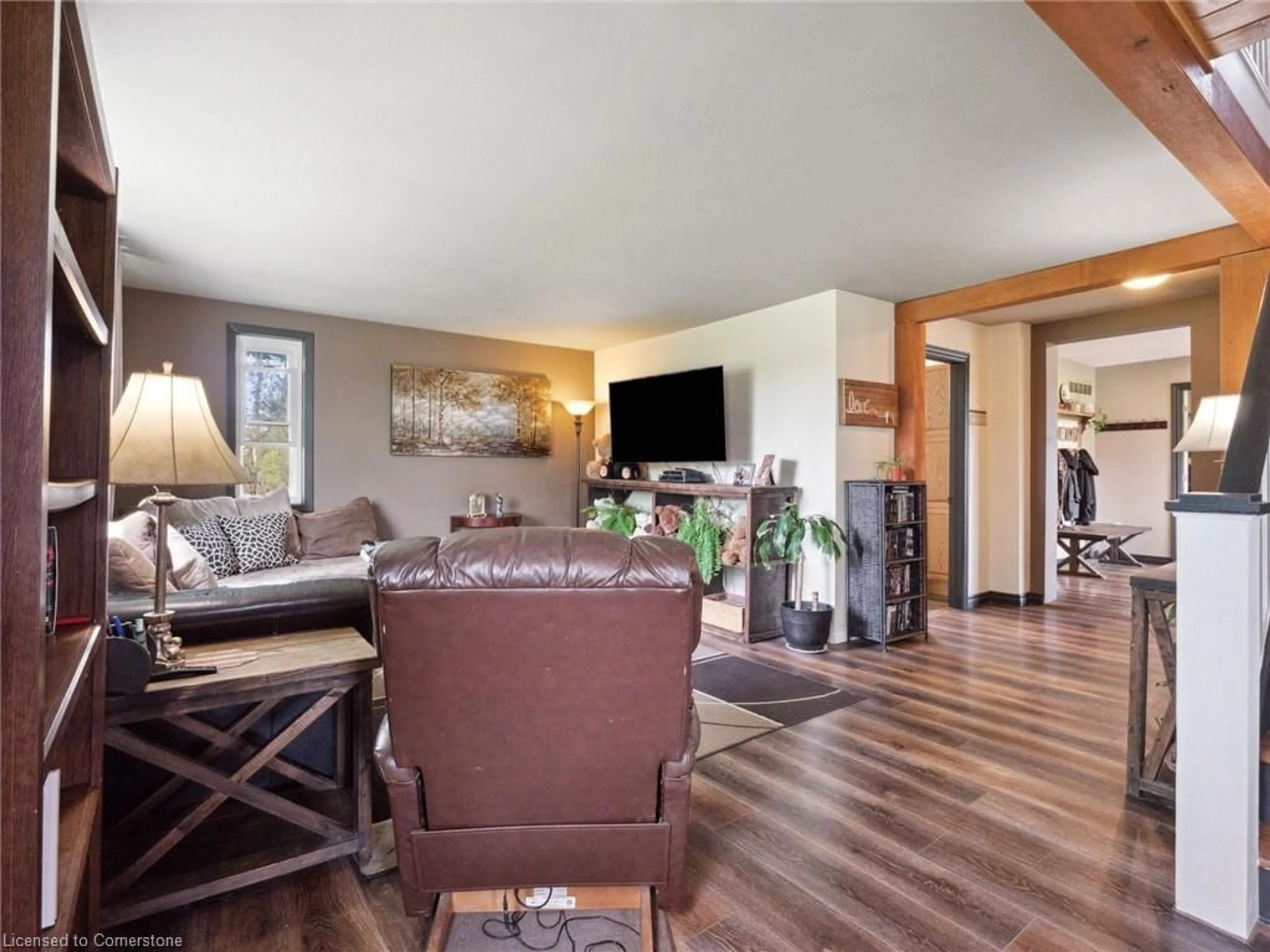 Living room with furniture, wood/laminate floor for 83456 Old River St, Wellandport Ontario L0R 2J0