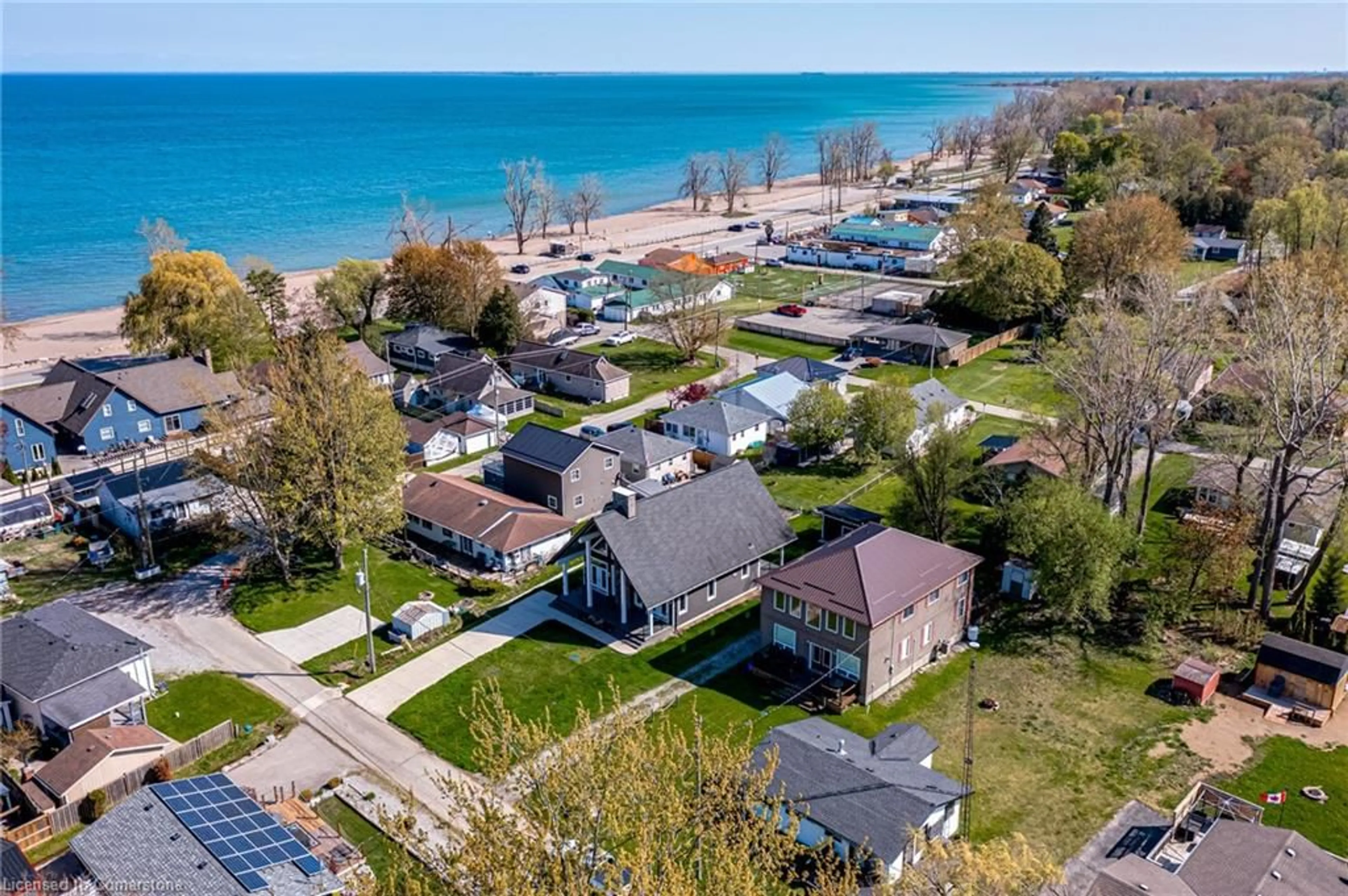 A pic from outside/outdoor area/front of a property/back of a property/a pic from drone, water/lake/river/ocean view for 18 Walter St, Turkey Point Ontario N0E 1T0
