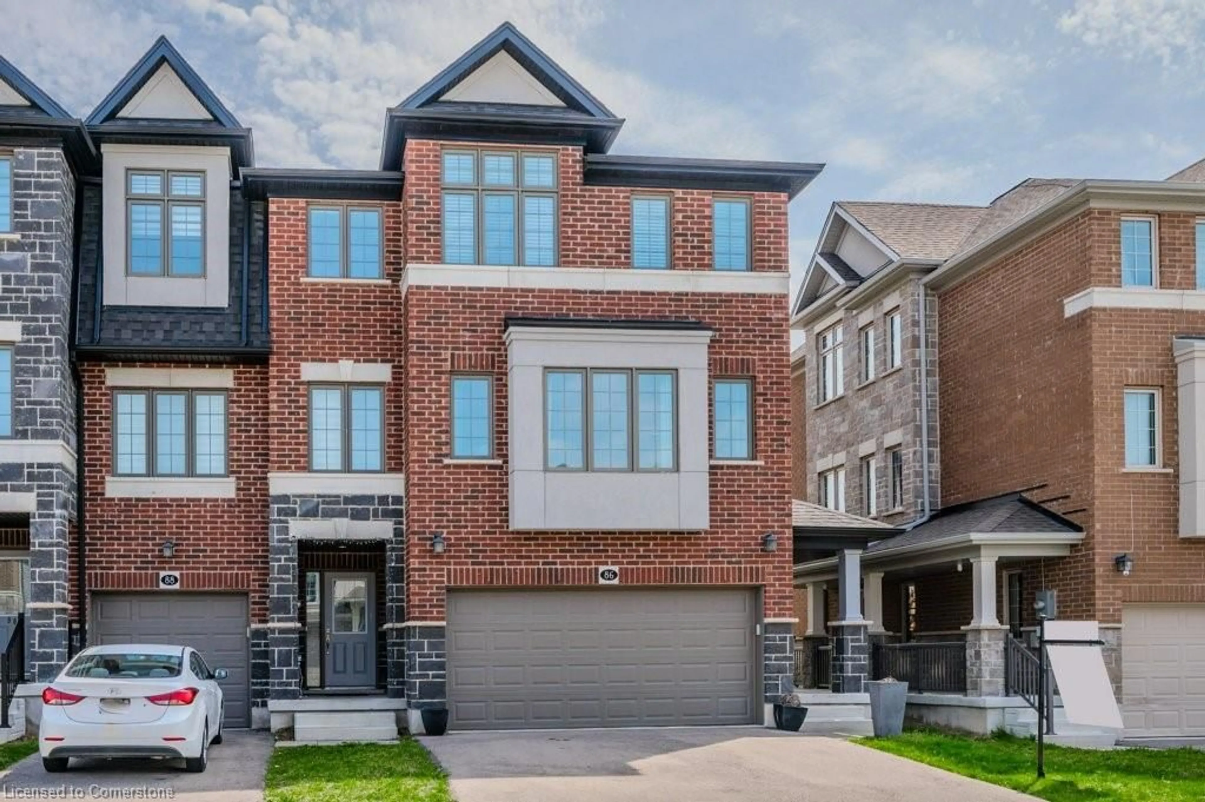 Home with brick exterior material, street for 86 Monarch Woods Dr, Kitchener Ontario N2P 0K1