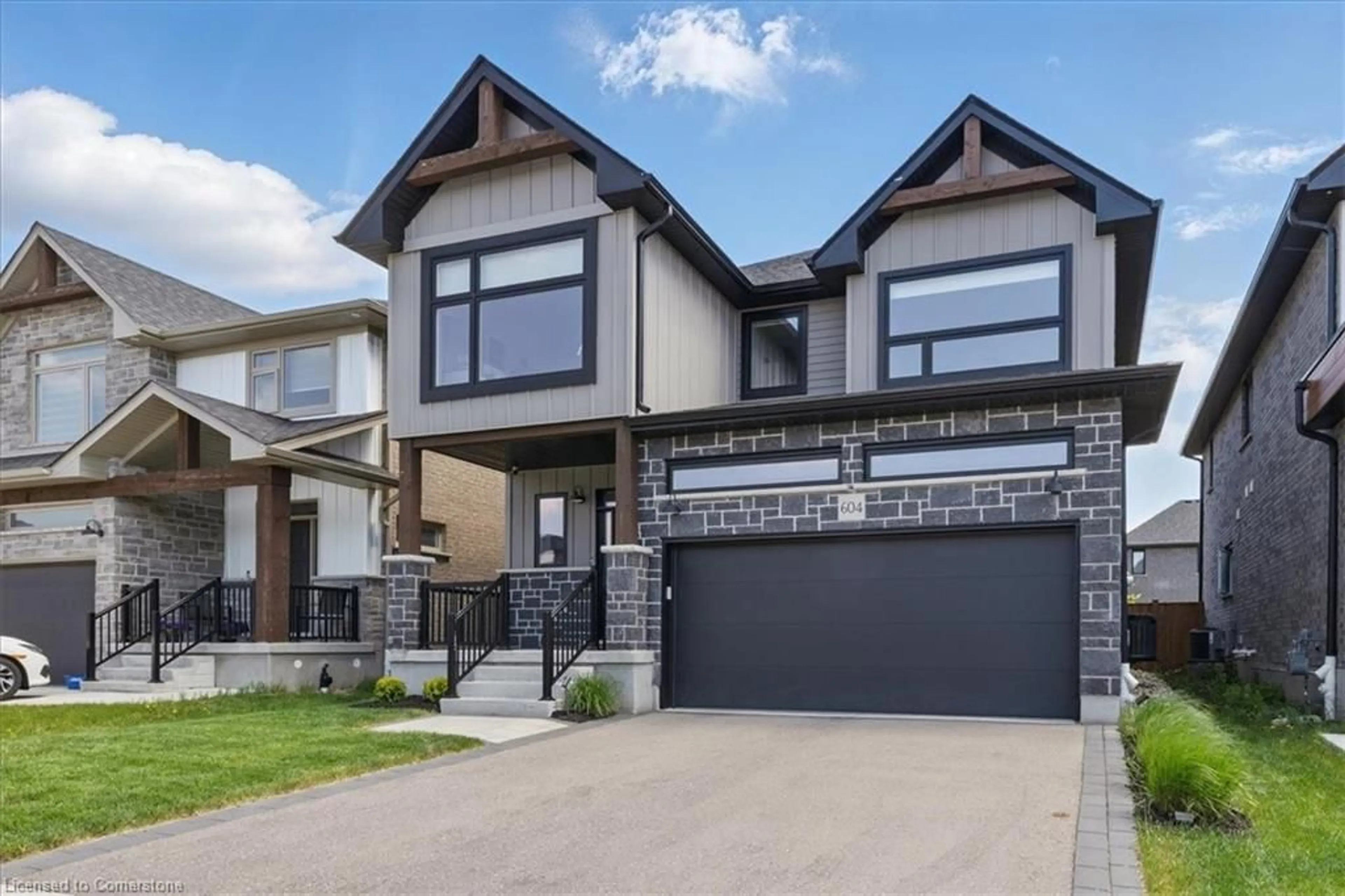 Home with brick exterior material, street for 604 Doonwoods Cres, Kitchener Ontario N2P 0E6