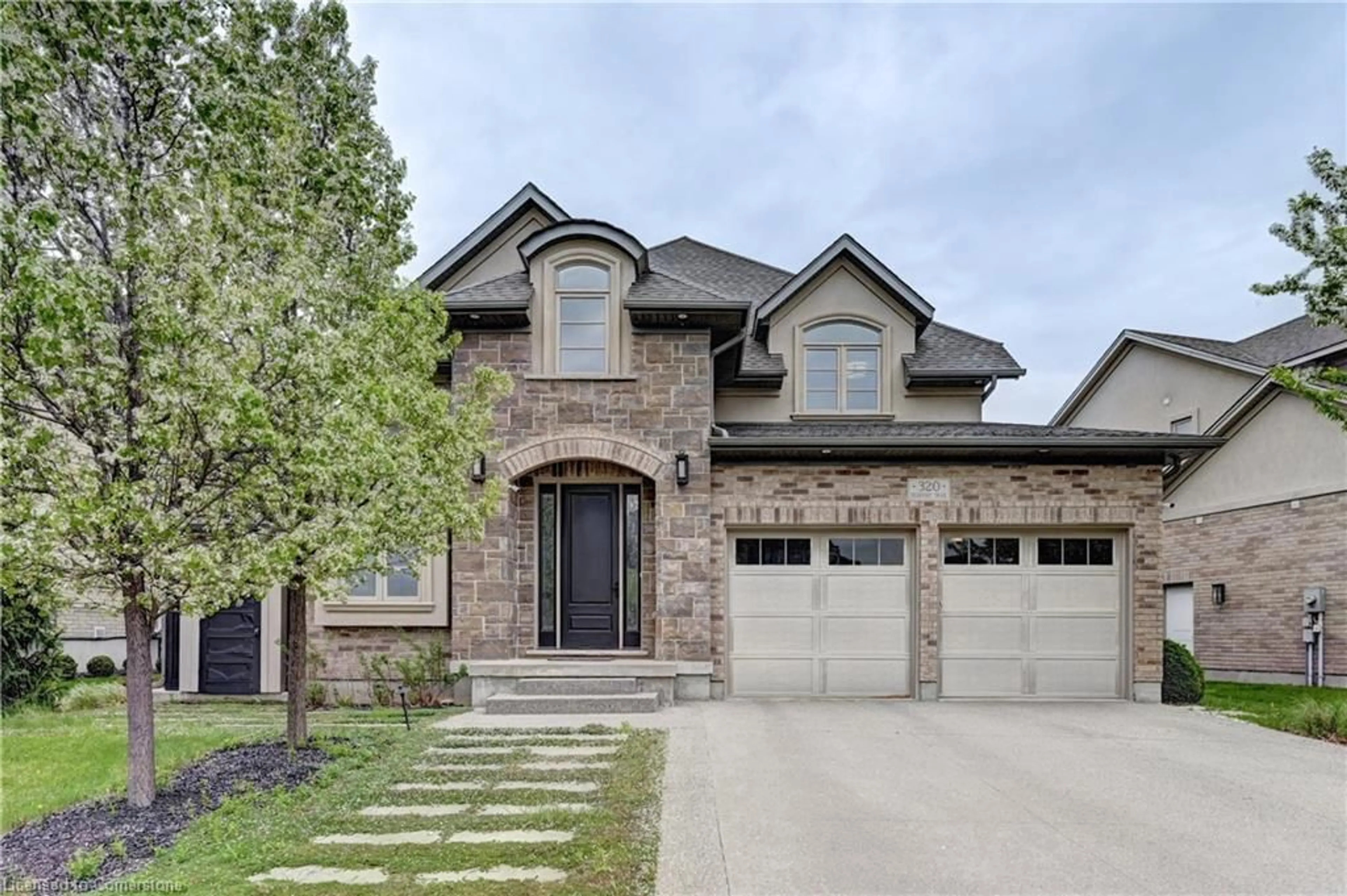 Home with brick exterior material, street for 320 Deerfoot Trail, Waterloo Ontario N2K 0B4