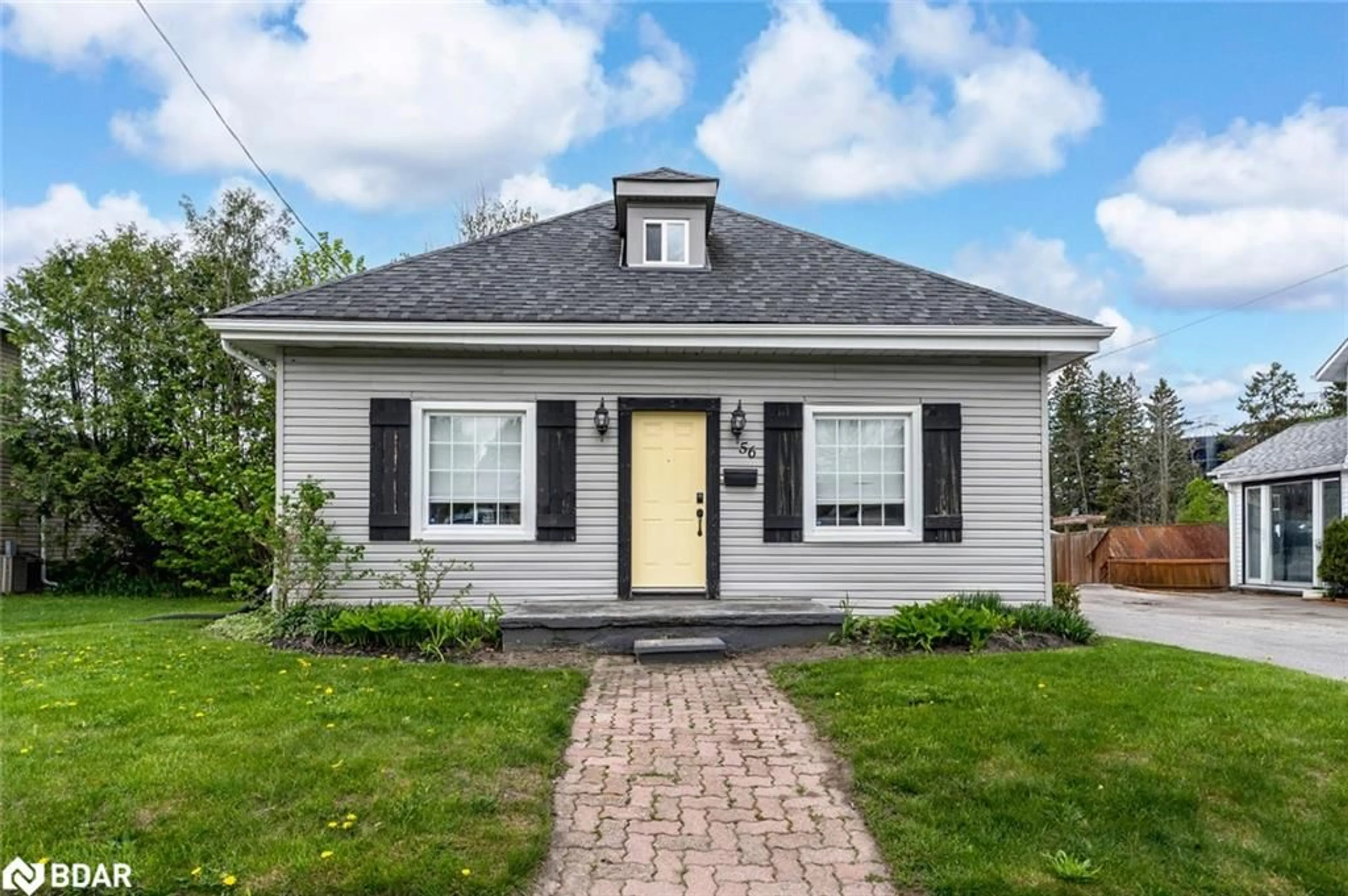 Home with vinyl exterior material, street for 56 Yonge St, Elmvale Ontario L0L 1P0