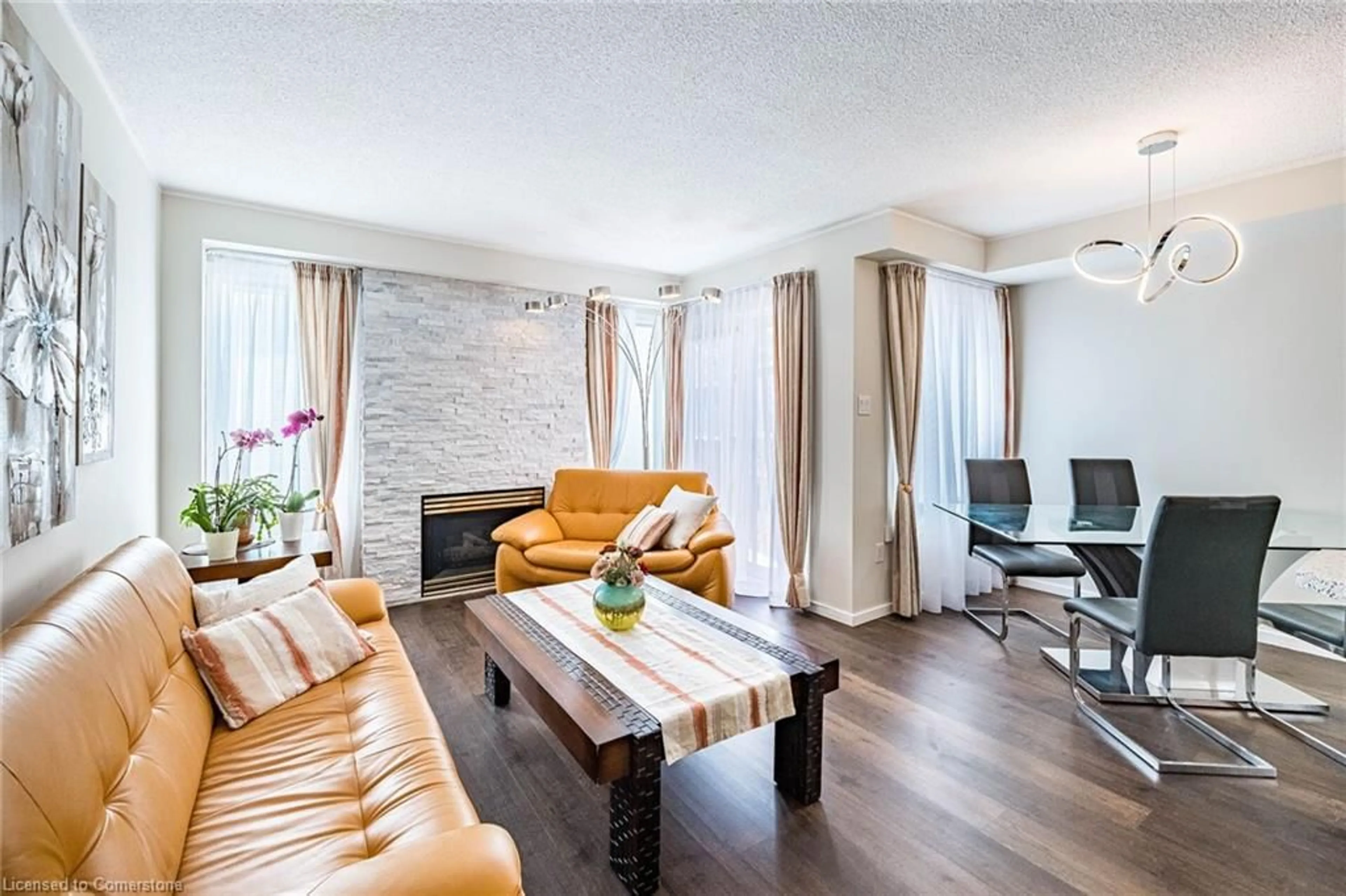 Living room with furniture, wood/laminate floor for 49 Emslie St, Georgetown Ontario L7G 5H5