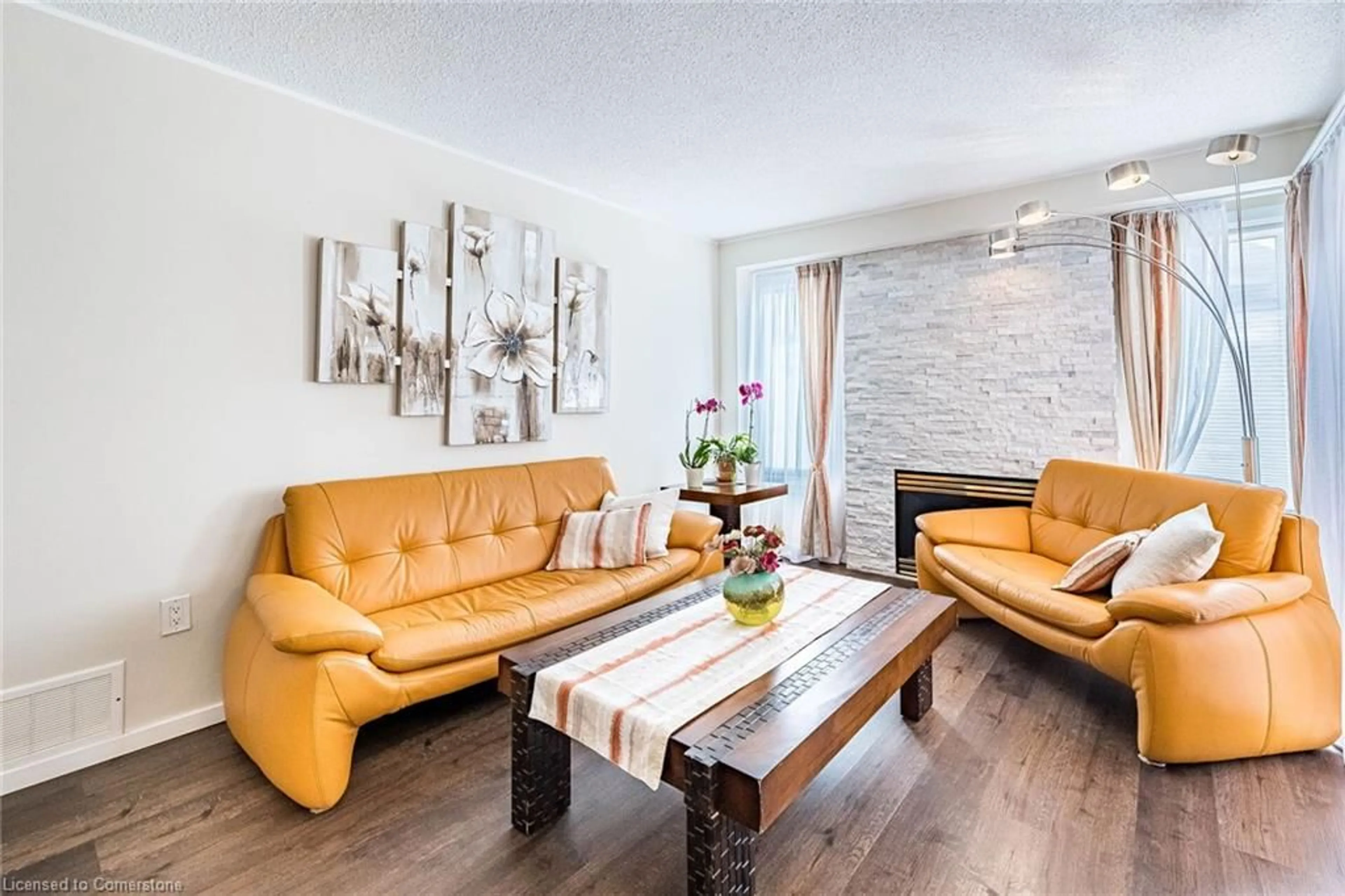 Living room with furniture, wood/laminate floor for 49 Emslie St, Georgetown Ontario L7G 5H5