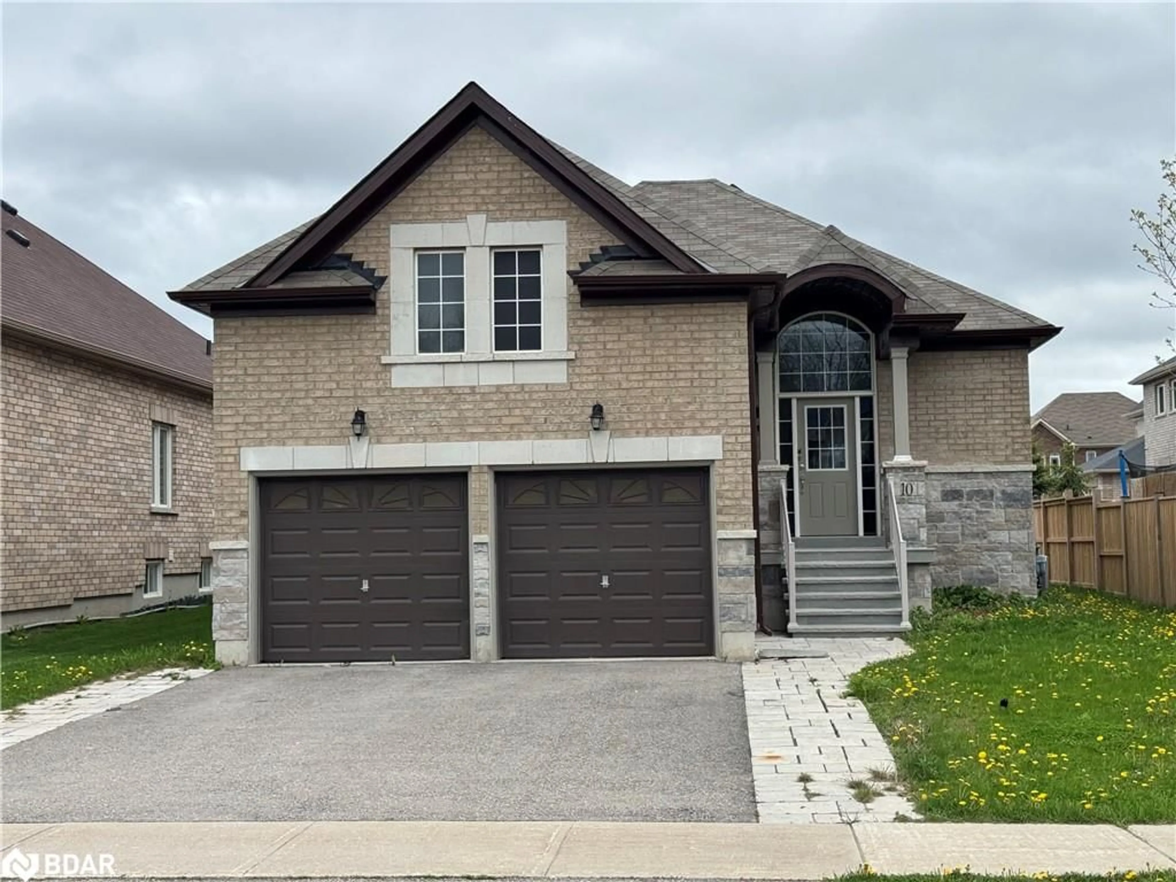 Home with brick exterior material, street for 10 Falvo Street St, Wasaga Beach Ontario L9Z 0G8
