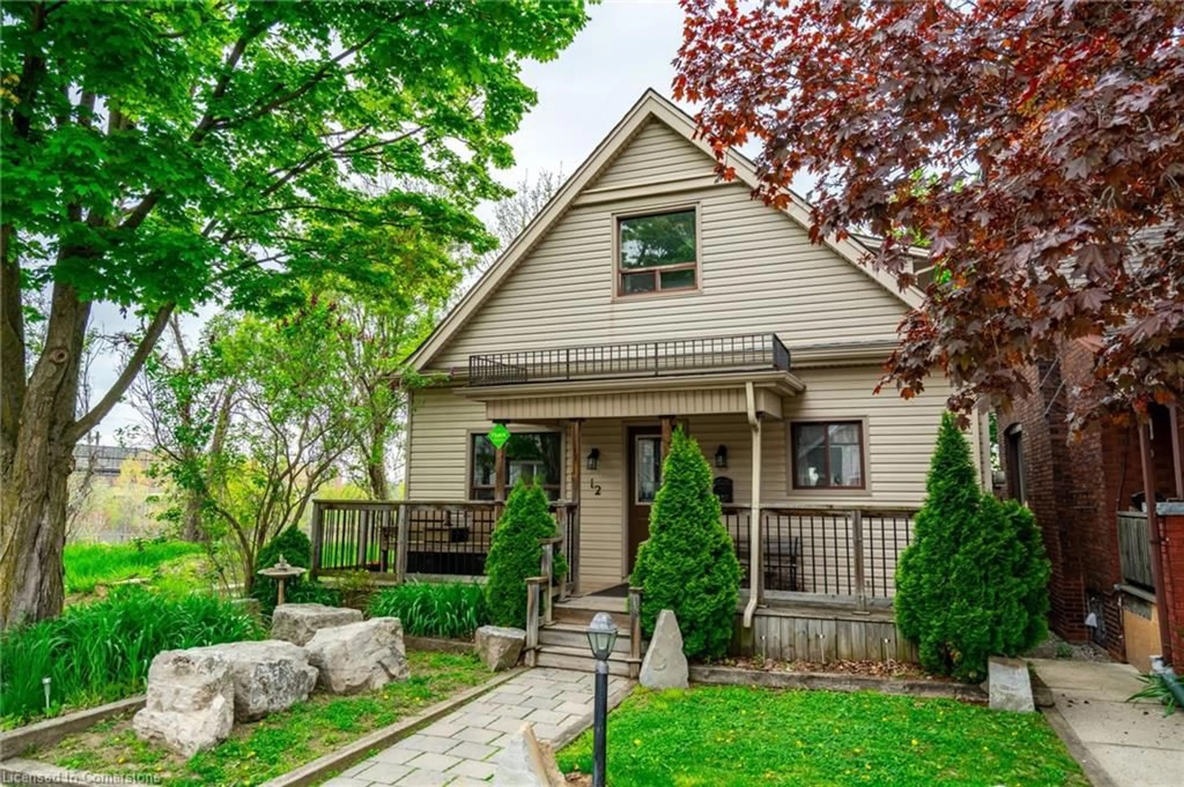 Home with vinyl exterior material, street for 12 Rossmore Ave, Hamilton Ontario L8P 2N3