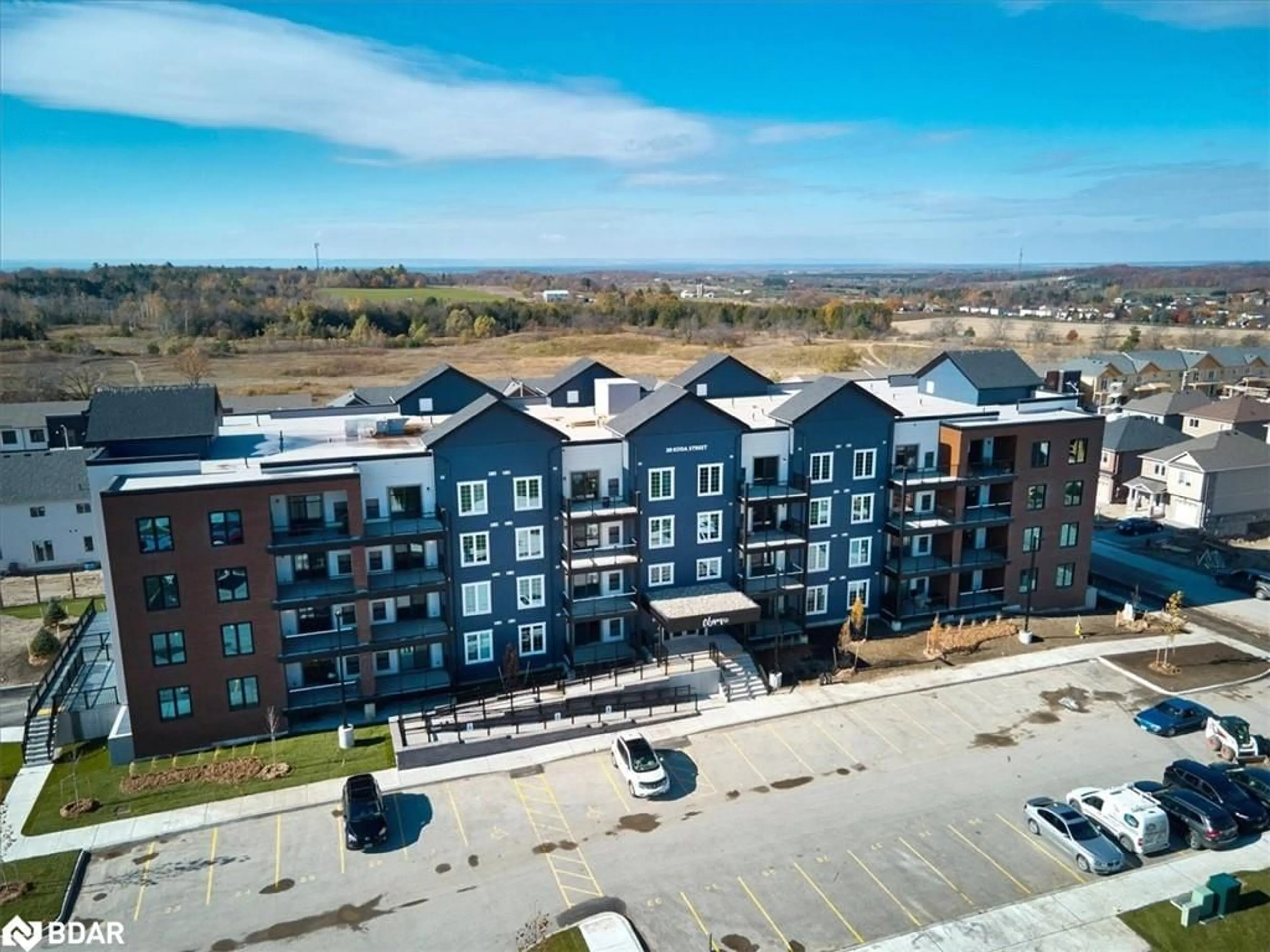 A pic from outside/outdoor area/front of a property/back of a property/a pic from drone, building for 20 Koda St #410, Barrie Ontario L9J 0J7