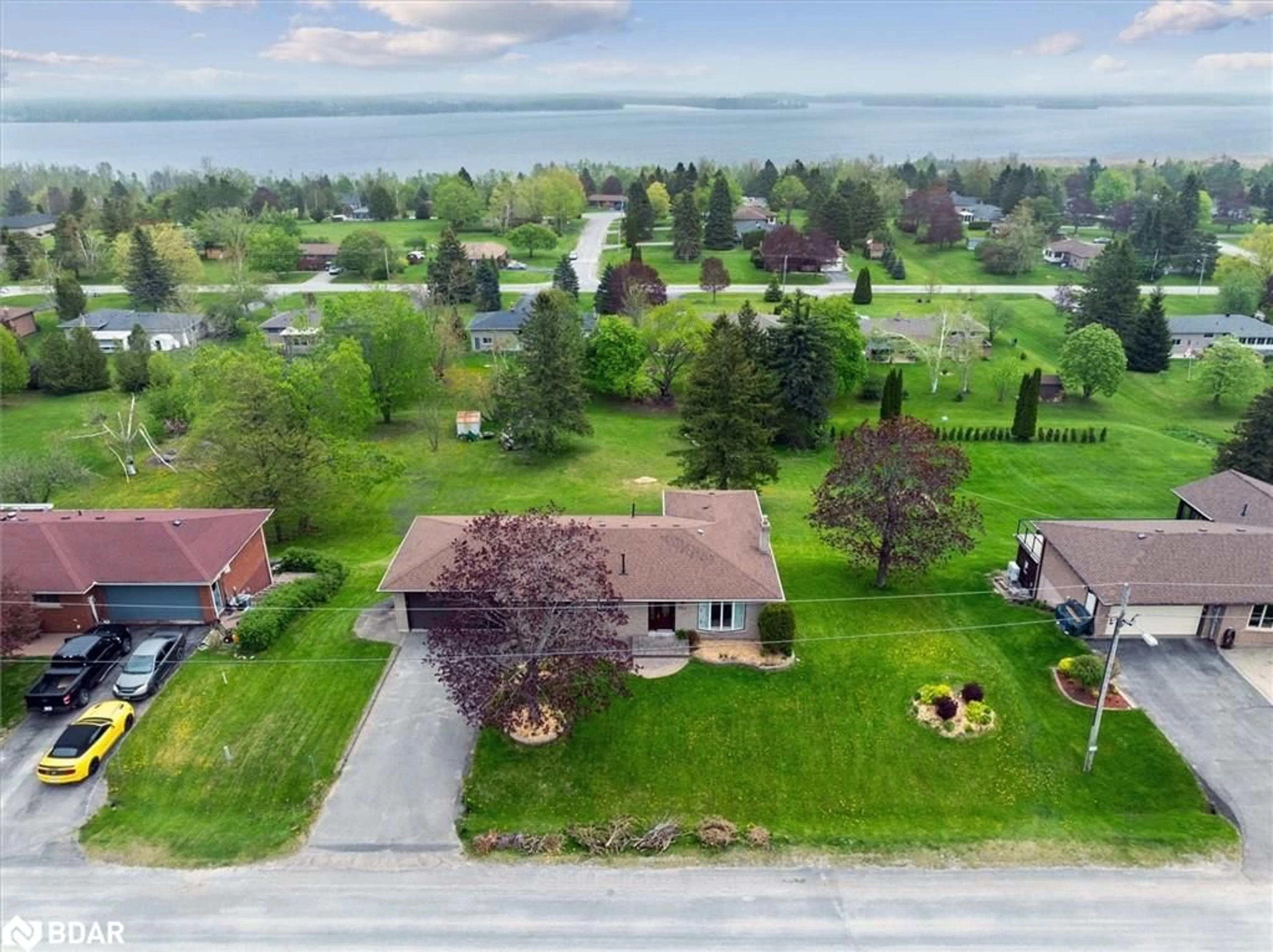 A pic from outside/outdoor area/front of a property/back of a property/a pic from drone, water/lake/river/ocean view for 381 Country Club Cir, Bobcaygeon Ontario K0M 1A0