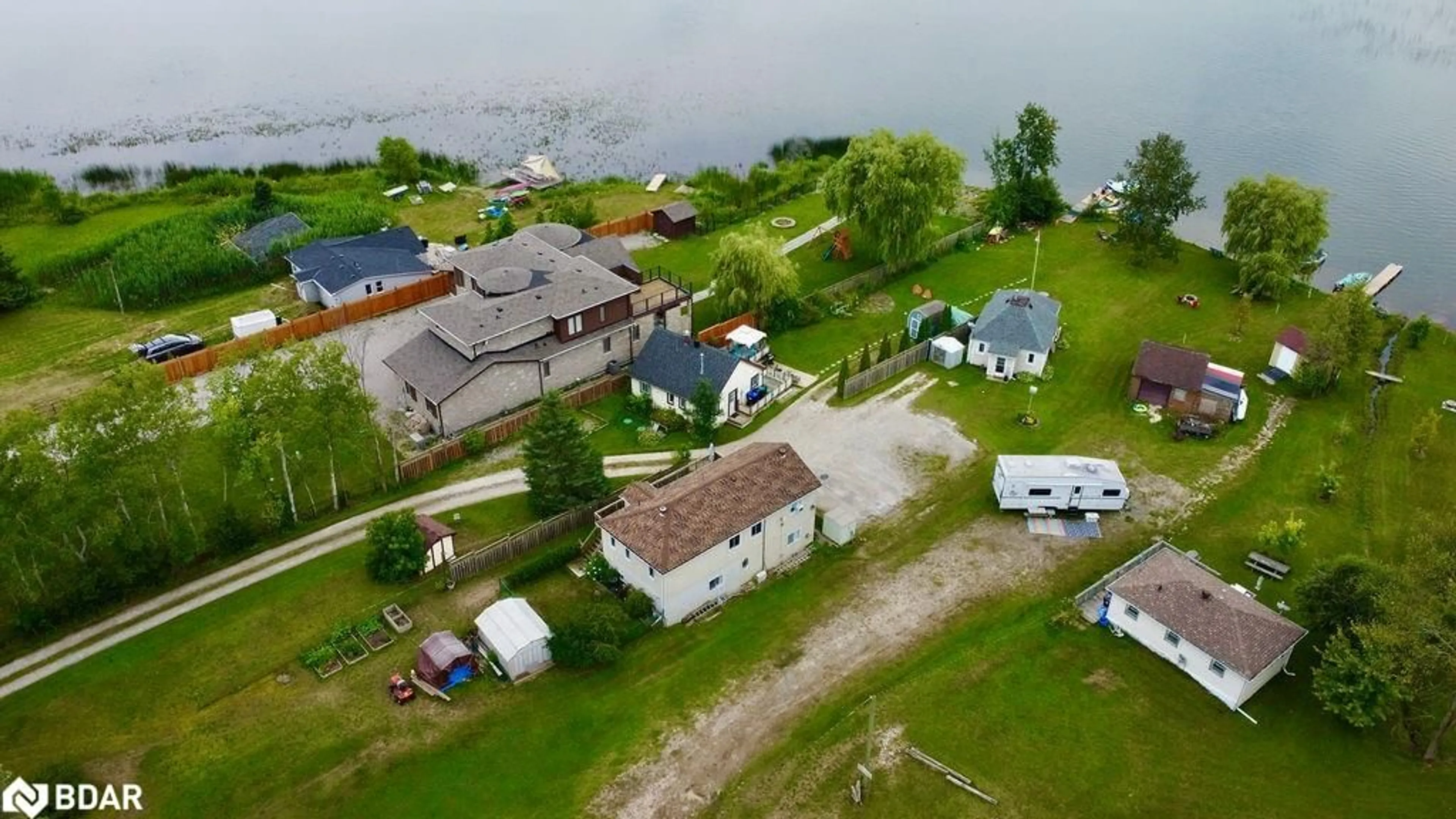 A pic from outside/outdoor area/front of a property/back of a property/a pic from drone, water/lake/river/ocean view for 5632 Penetanguishene Rd, Elmvale Ontario L0L 1P0