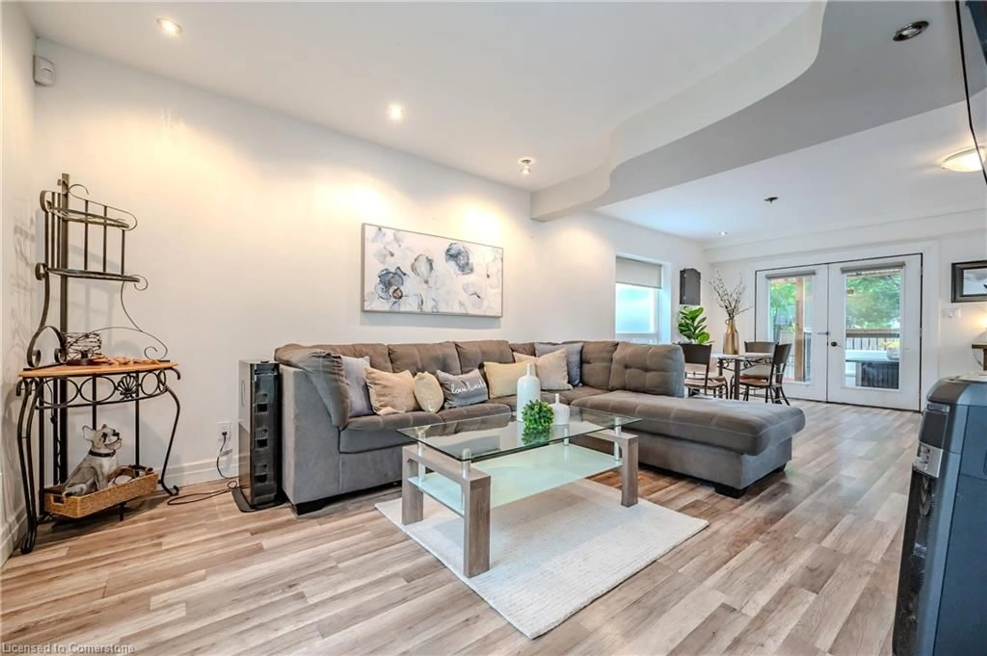 Living room with furniture, wood/laminate floor for 33 Glasgow St, Kitchener Ontario N2G 2G6