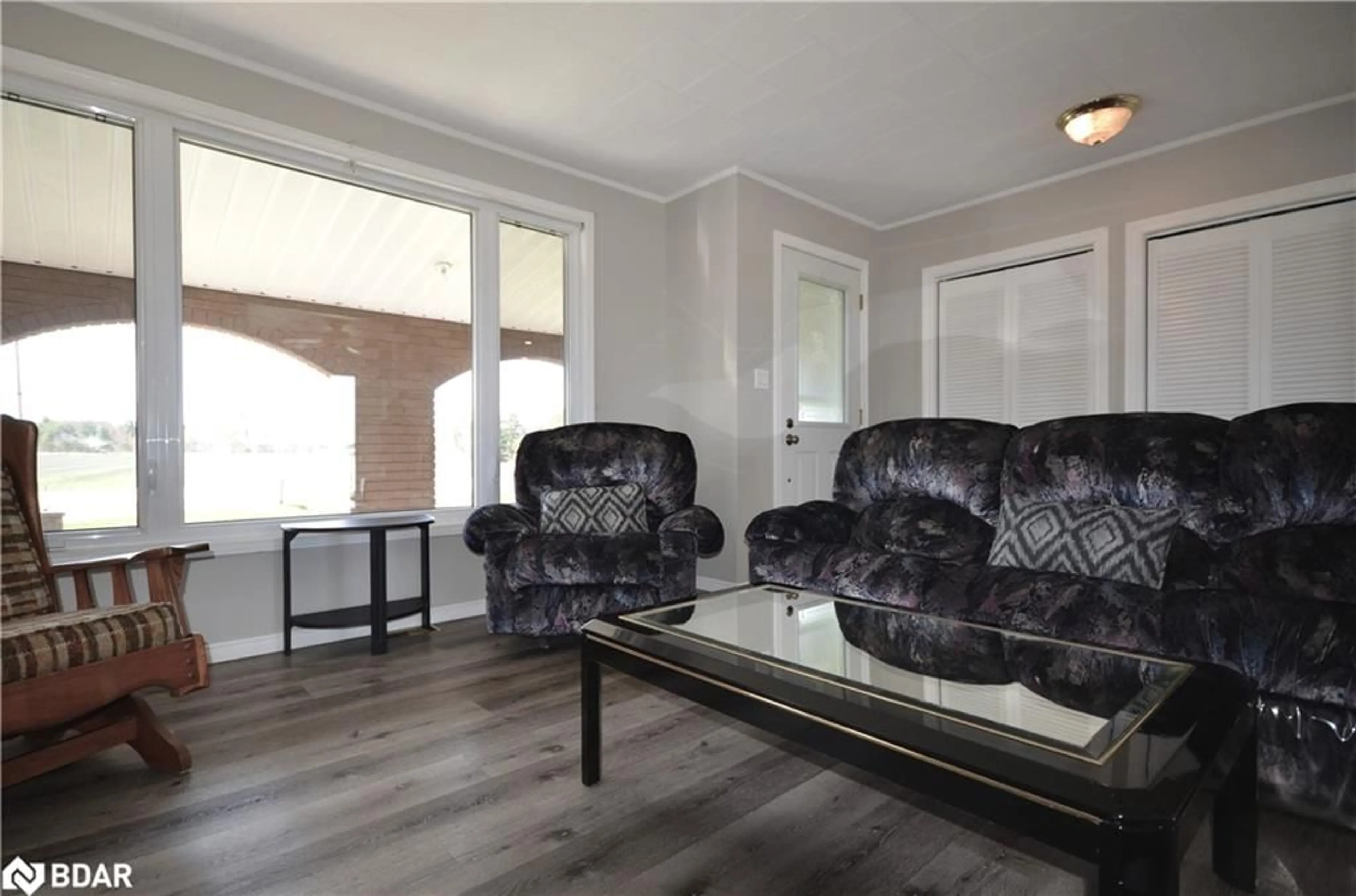 Living room with furniture, wood/laminate floor for 11704 Hwy 64, Verner Ontario P0H 2M0