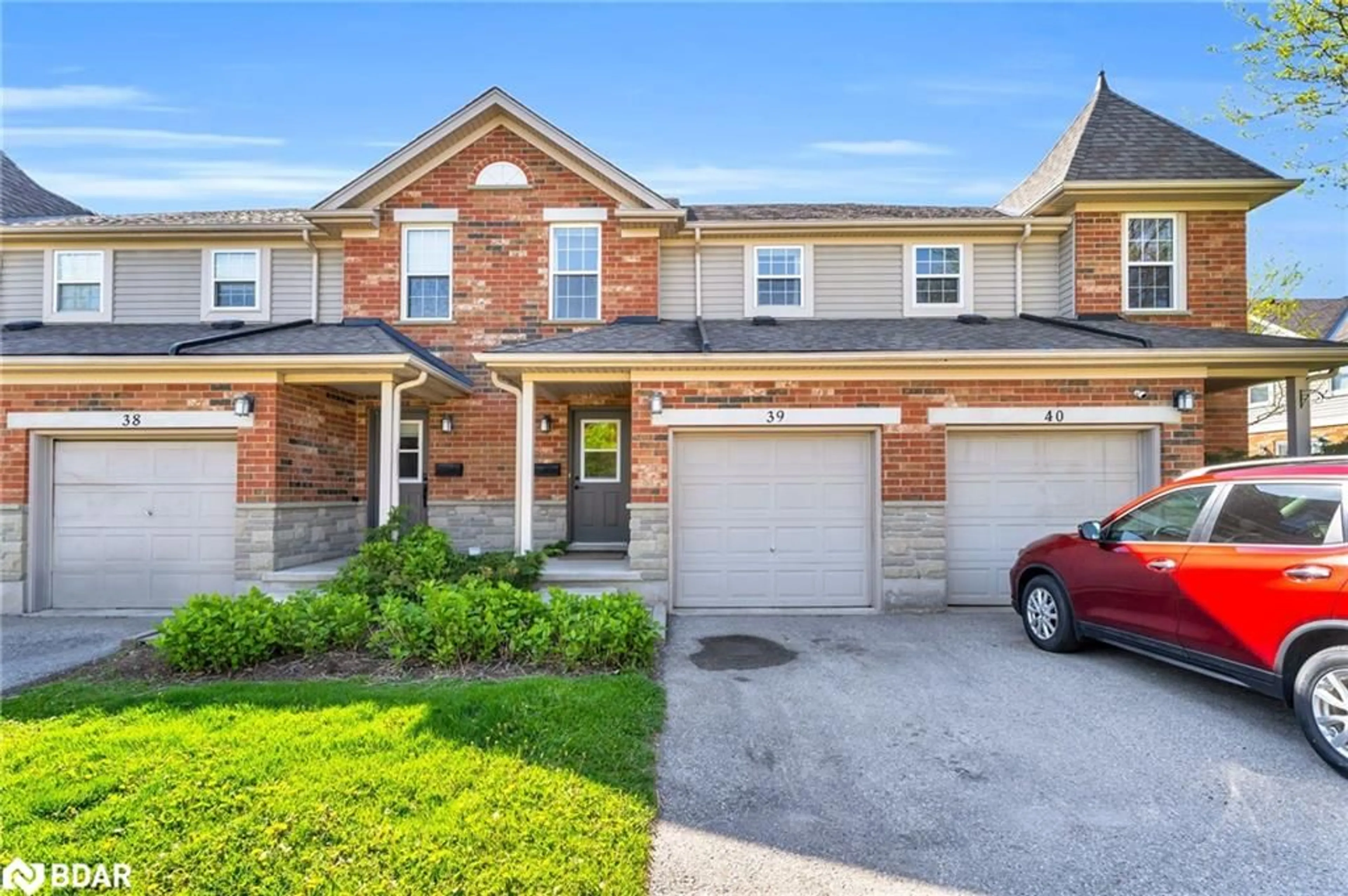 Home with brick exterior material, street for 124 Gosling Gdns #39, Guelph Ontario N1G 5K6