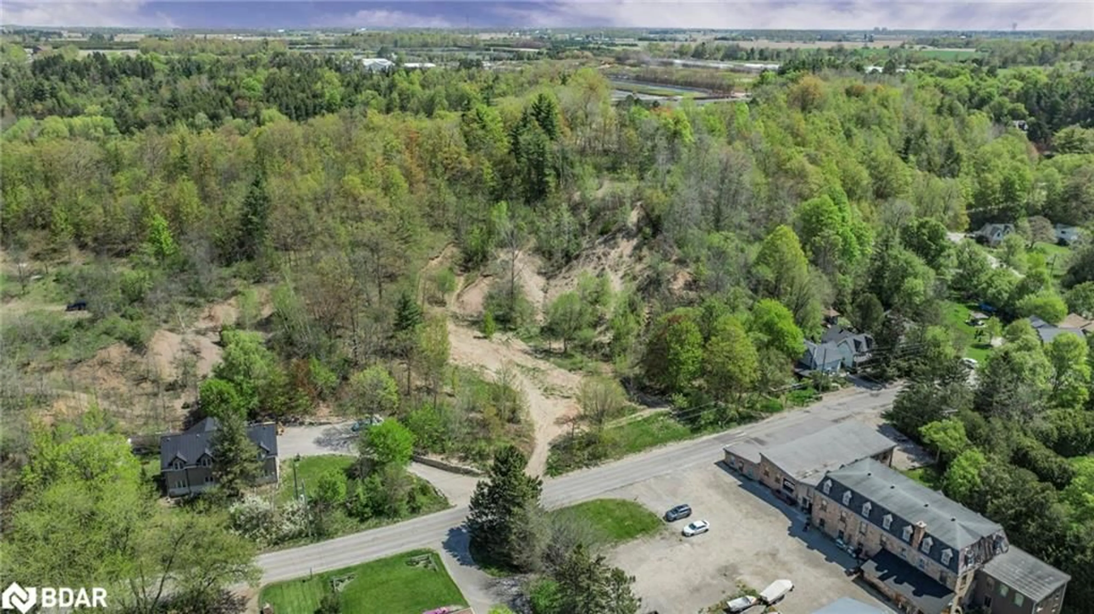 A pic from outside/outdoor area/front of a property/back of a property/a pic from drone, forest/trees view for 22 Main St St, Glen Williams Ontario L7G 3G8