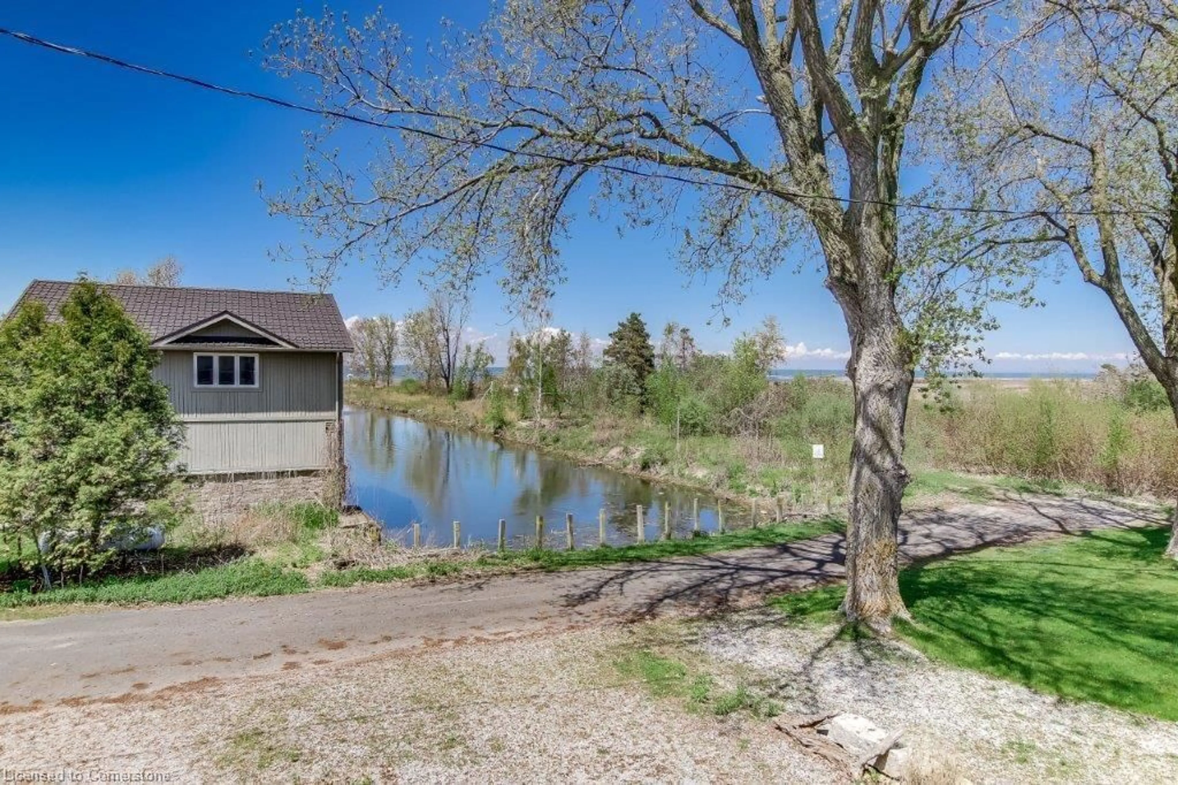 A pic from outside/outdoor area/front of a property/back of a property/a pic from drone, water/lake/river/ocean view for 3 Warbler Lane, Long Point Ontario N0E 1M0