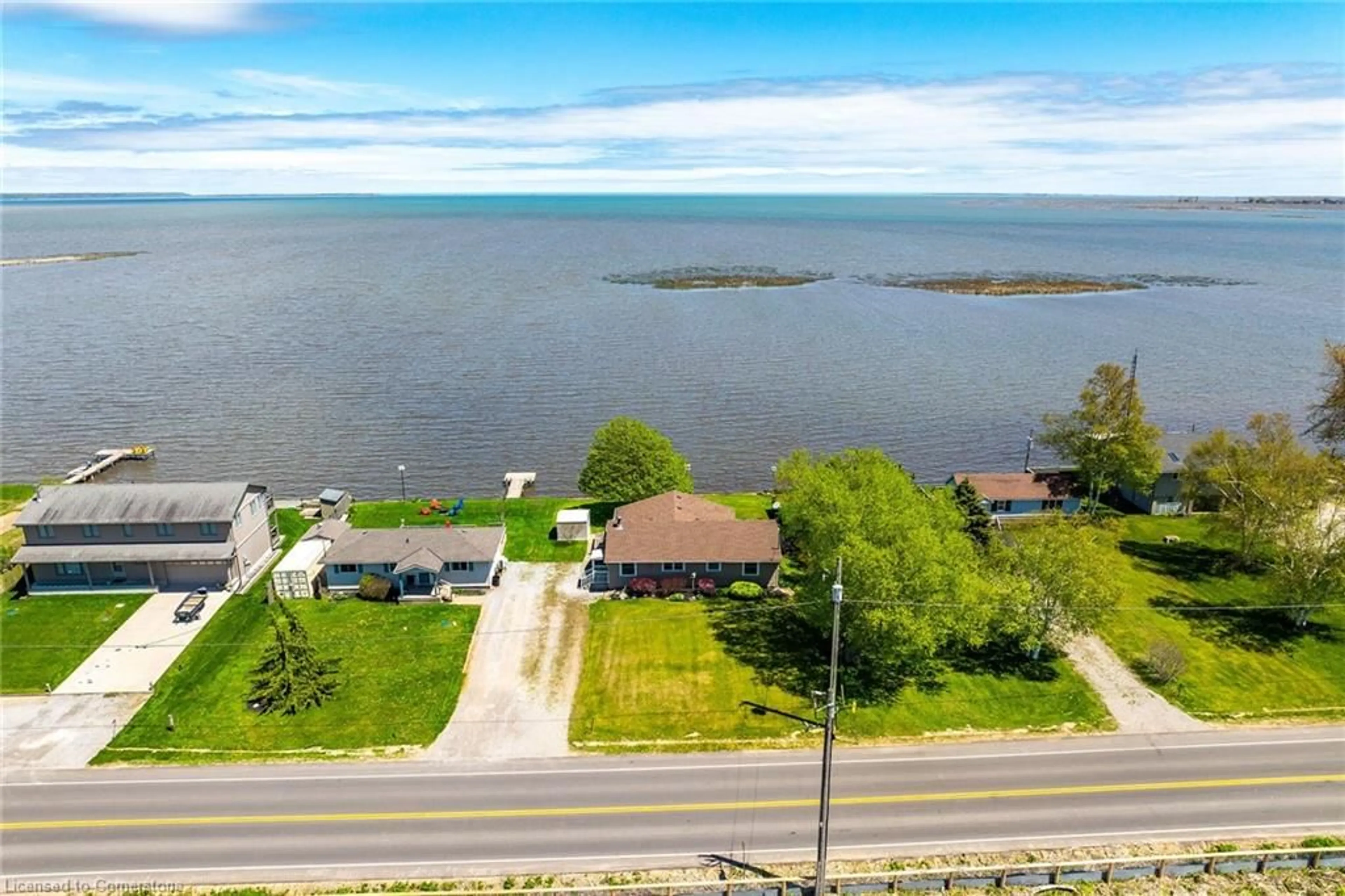 A pic from outside/outdoor area/front of a property/back of a property/a pic from drone, water/lake/river/ocean view for 794 59 Hwy, Port Rowan Ontario N0E 1M0