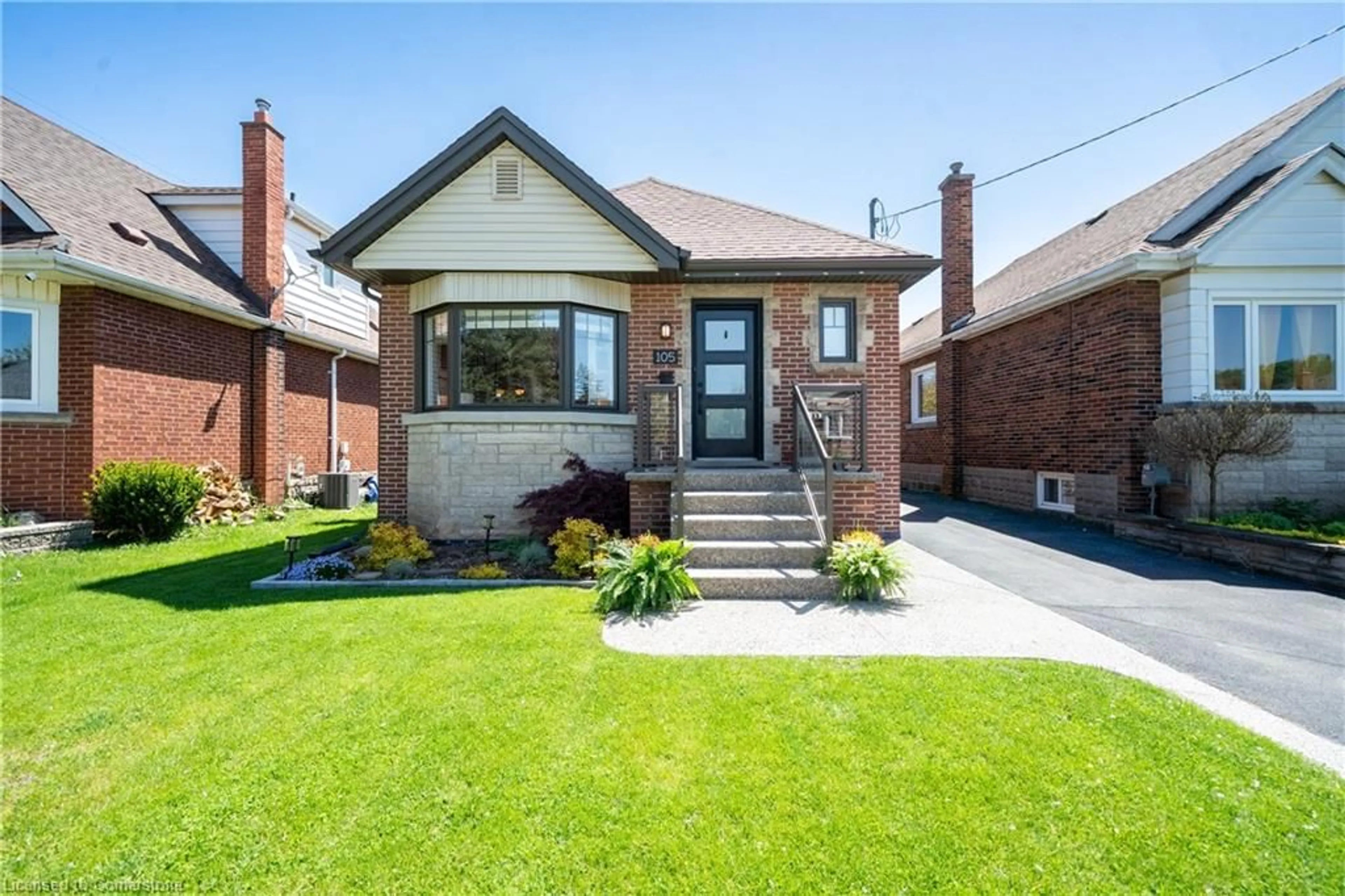 Home with brick exterior material, street for 105 Tragina Ave, Hamilton Ontario L8K 2Z7
