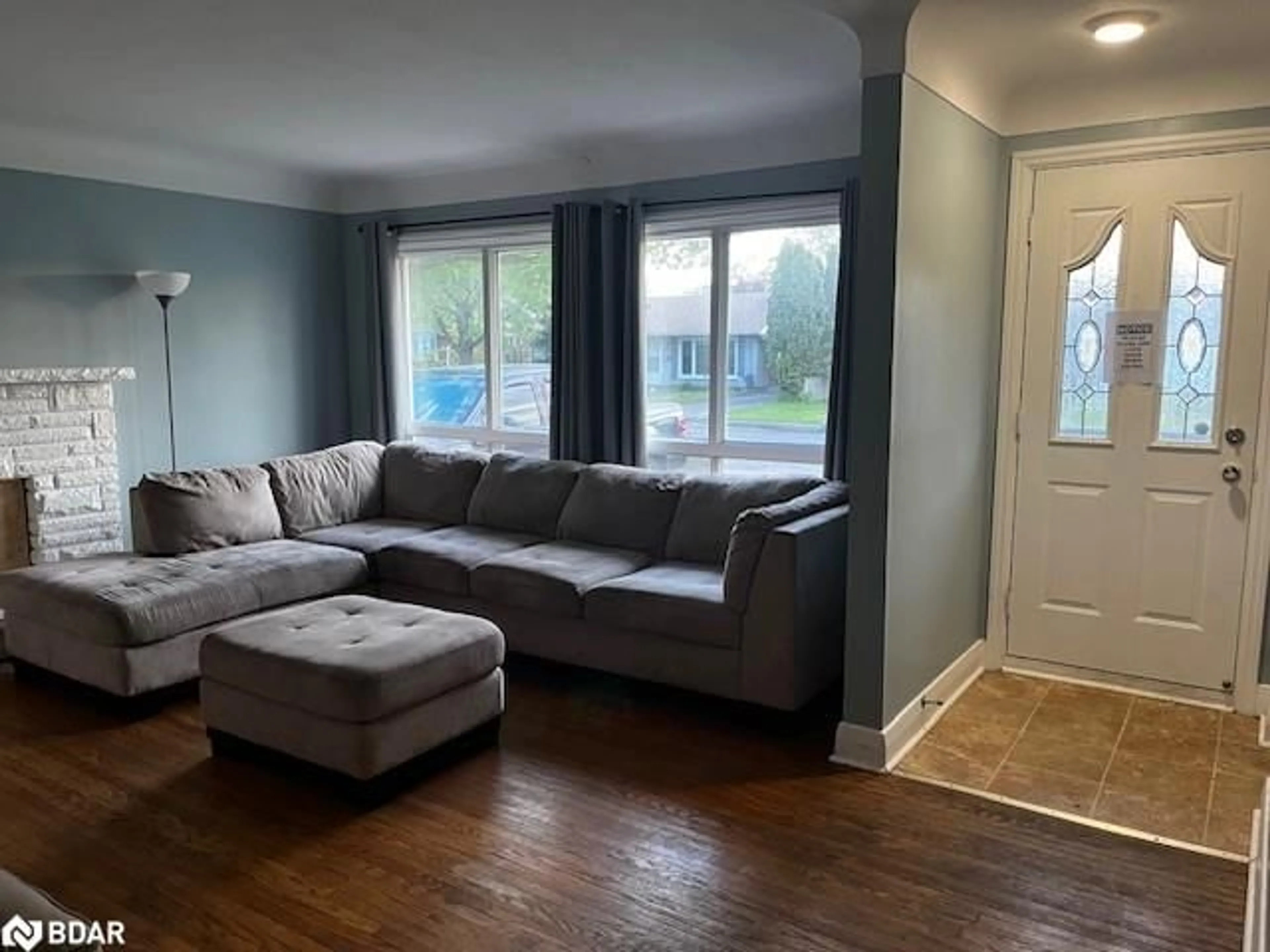 Living room with furniture, wood/laminate floor for 121 Jacobson Ave, St. Catharines Ontario L2T 3A6