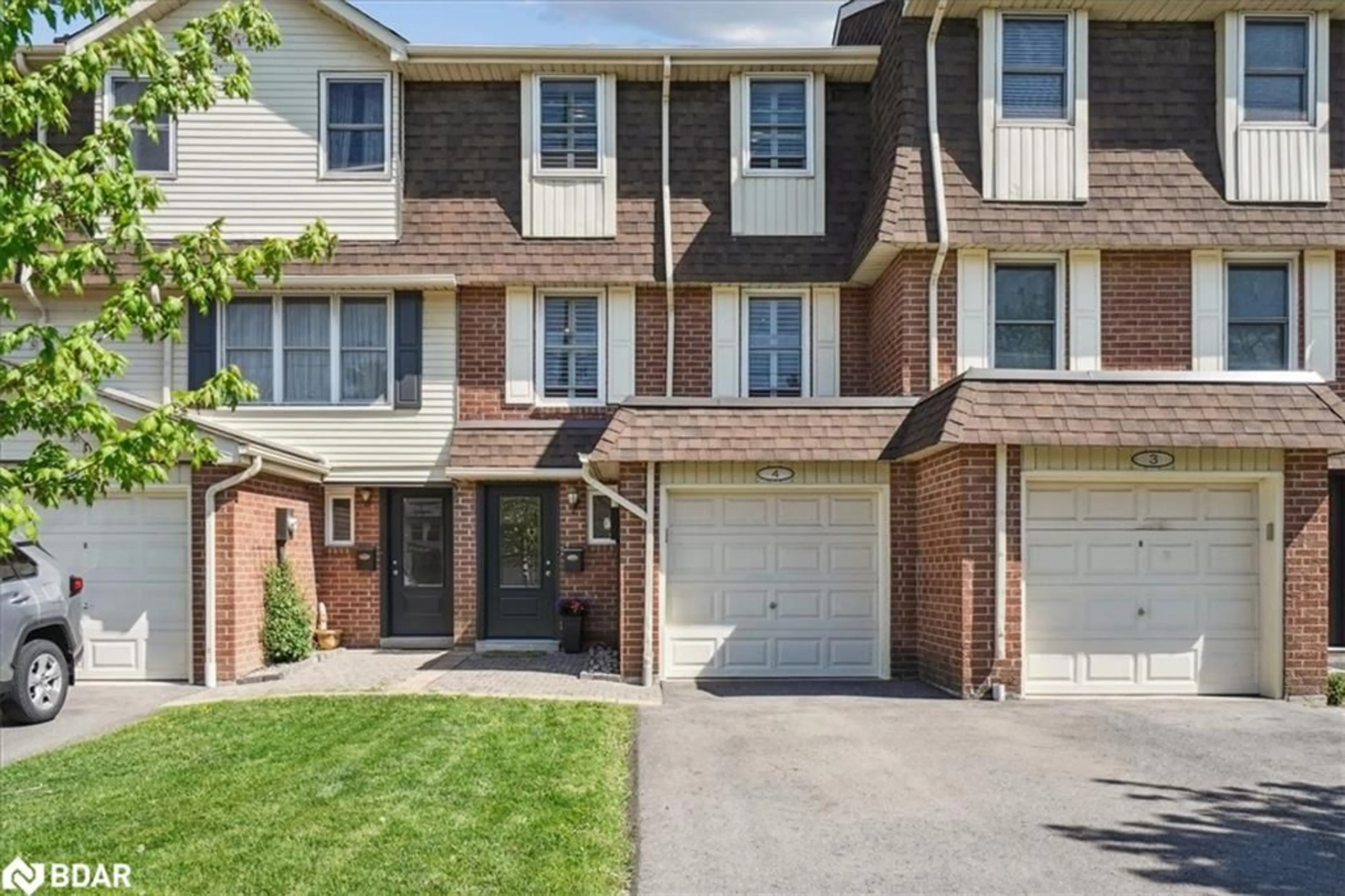 Home with brick exterior material, street for 30 Heslop Rd #4, Milton Ontario L9T 1B3