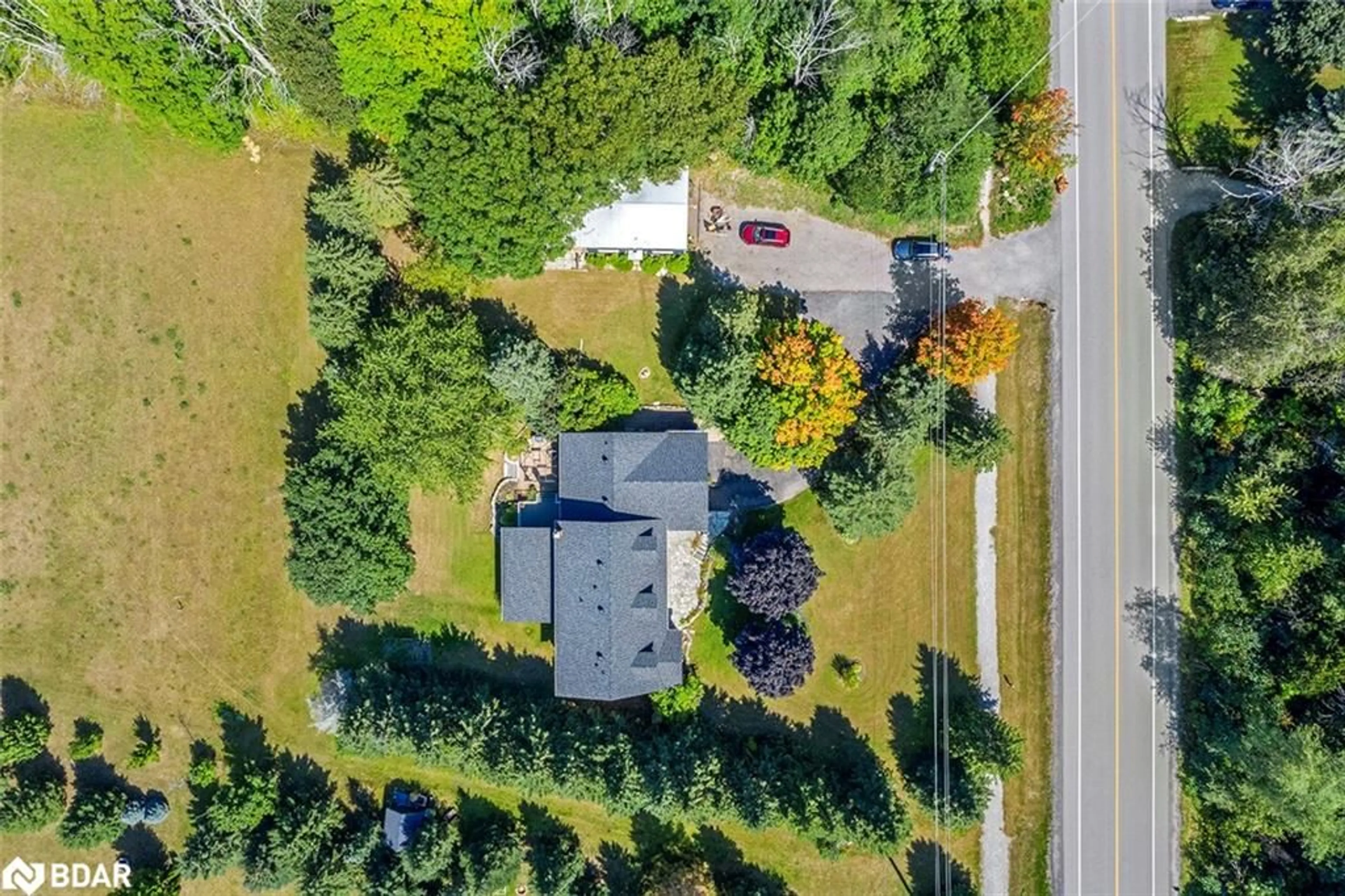 A pic from outside/outdoor area/front of a property/back of a property/a pic from drone, street for 2038 Snow Valley Road, Minesing Ontario L0L 1Y3