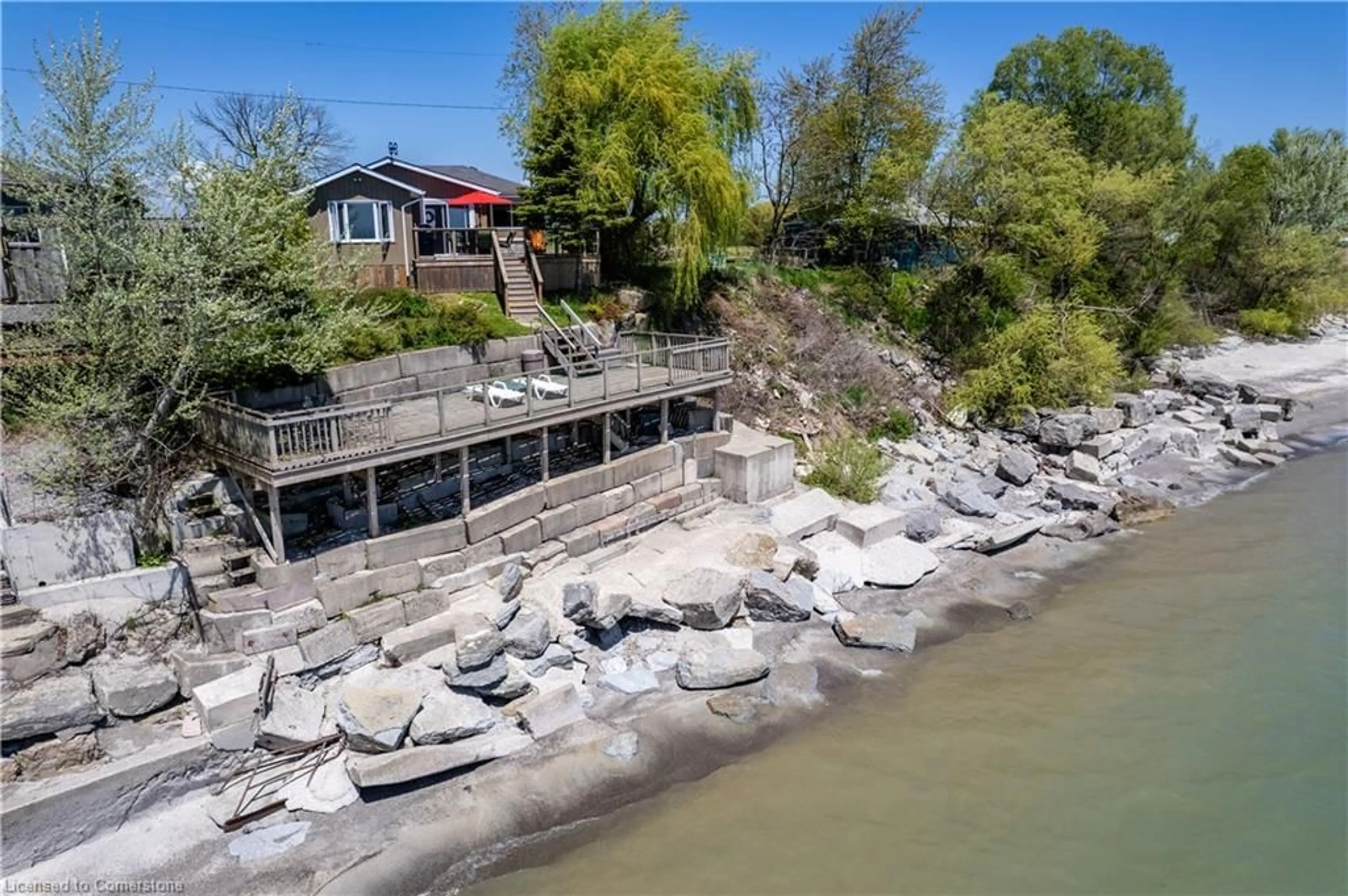 A pic from outside/outdoor area/front of a property/back of a property/a pic from drone, water/lake/river/ocean view for 33 Gull Line, Lowbanks Ontario N0A 1K0