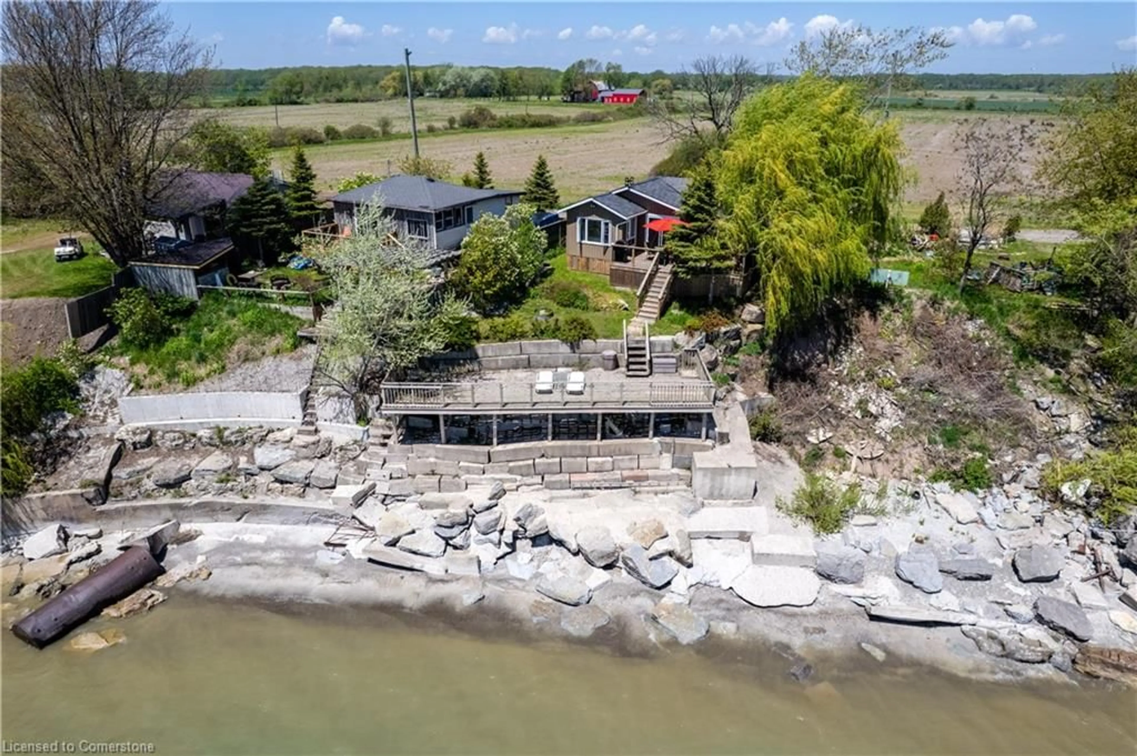 A pic from outside/outdoor area/front of a property/back of a property/a pic from drone, water/lake/river/ocean view for 33 Gull Line, Lowbanks Ontario N0A 1K0