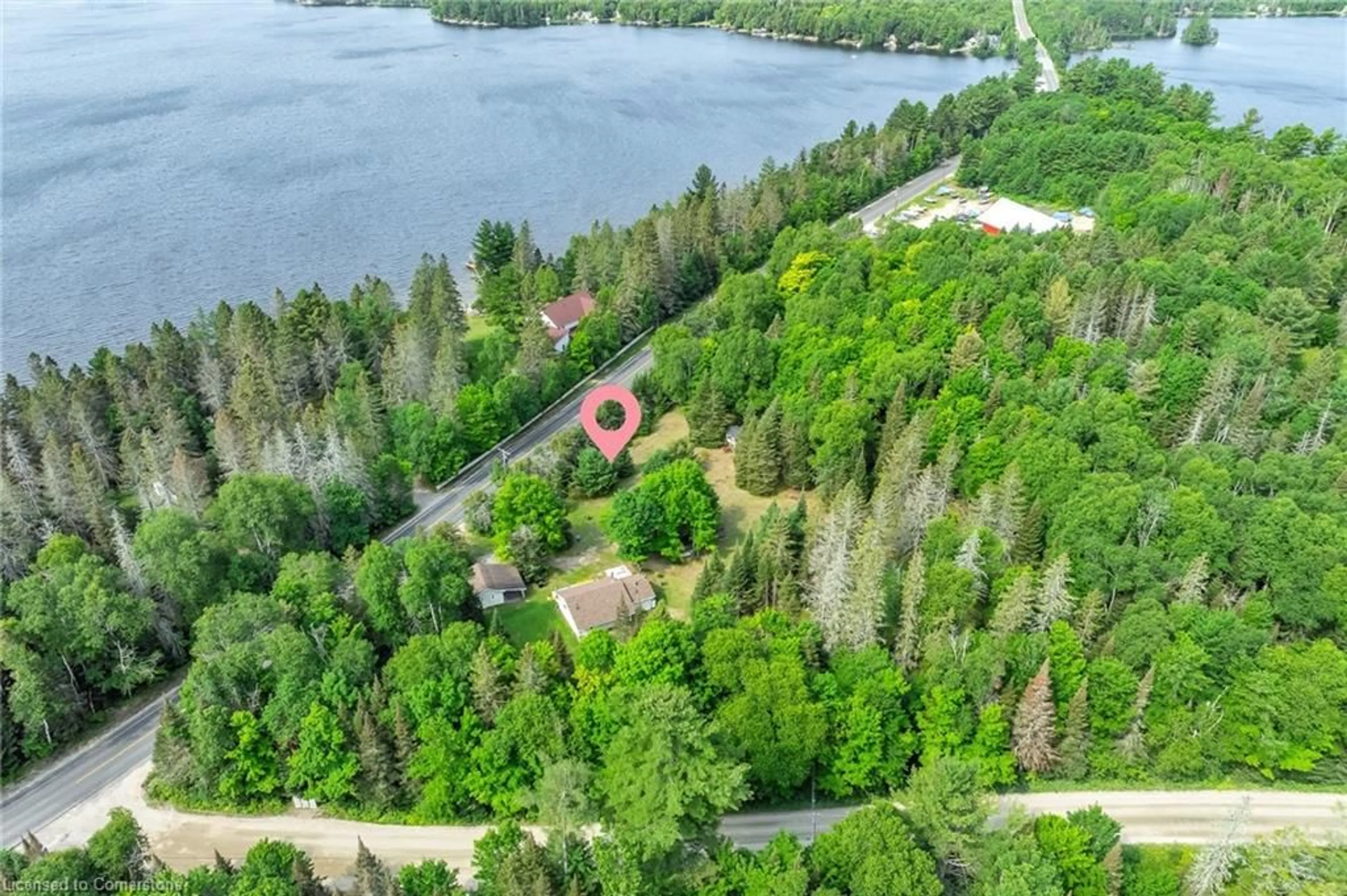 A pic from outside/outdoor area/front of a property/back of a property/a pic from drone, water/lake/river/ocean view for 2288 Eagle Lk Rd Rd, Machar Ontario P0A 1X0