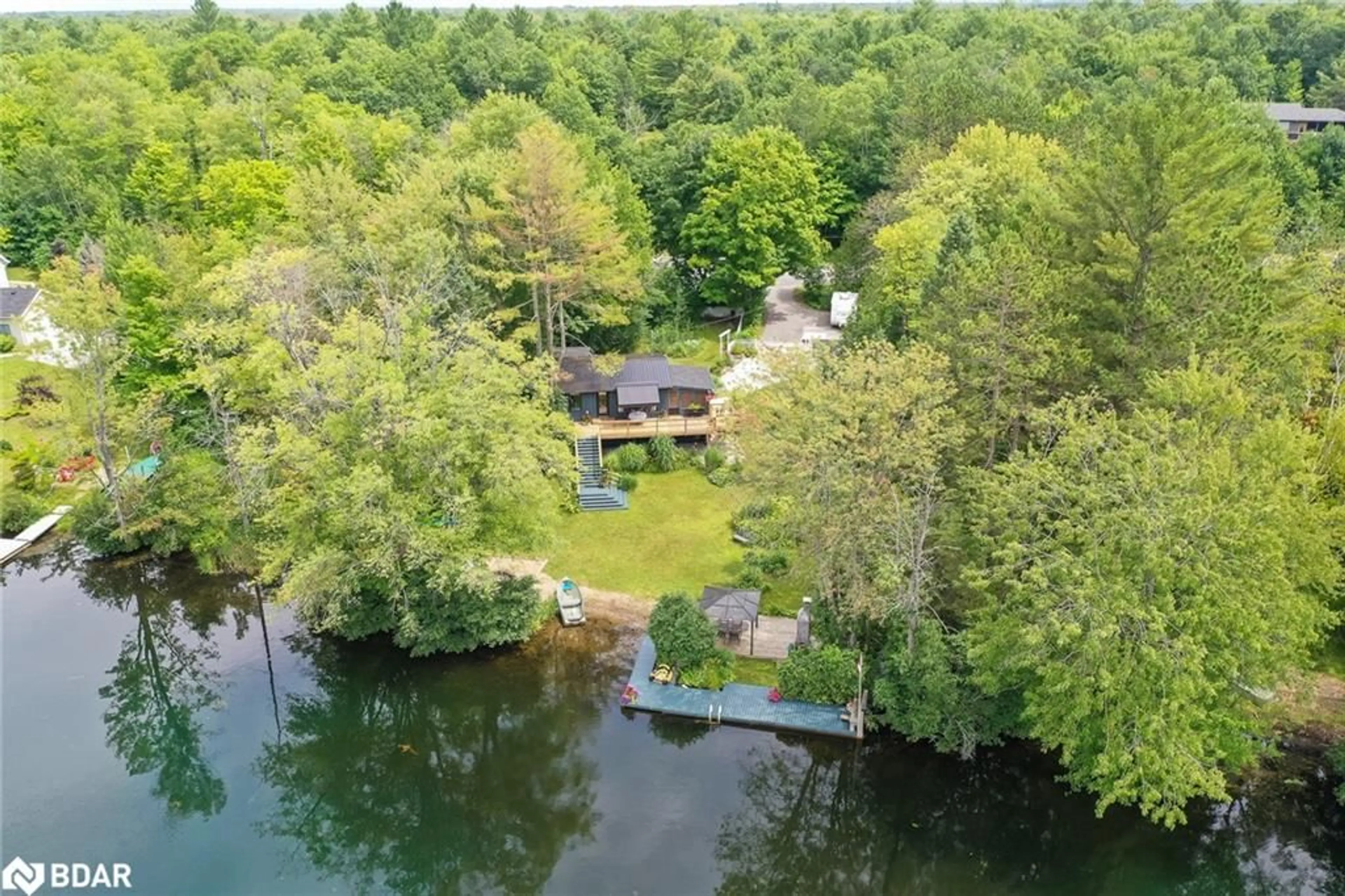 A pic from outside/outdoor area/front of a property/back of a property/a pic from drone, water/lake/river/ocean view for 7862 Birch Dr, Washago Ontario L0K 2B0